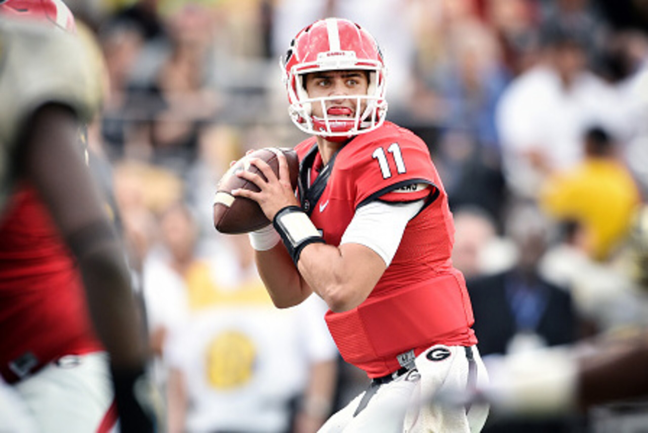 NASHVILLE, TN - SEPTEMBER 12:  Quarterback Greyson Lambert #11 of the Georgia Bulldogs looks for a receiver against the Vanderbilt Commodores at Vanderbilt Stadium on September 12, 2015 in Nashville, Tennessee.  (Photo by Ronald C. Modra/Sports Imagery/Ge