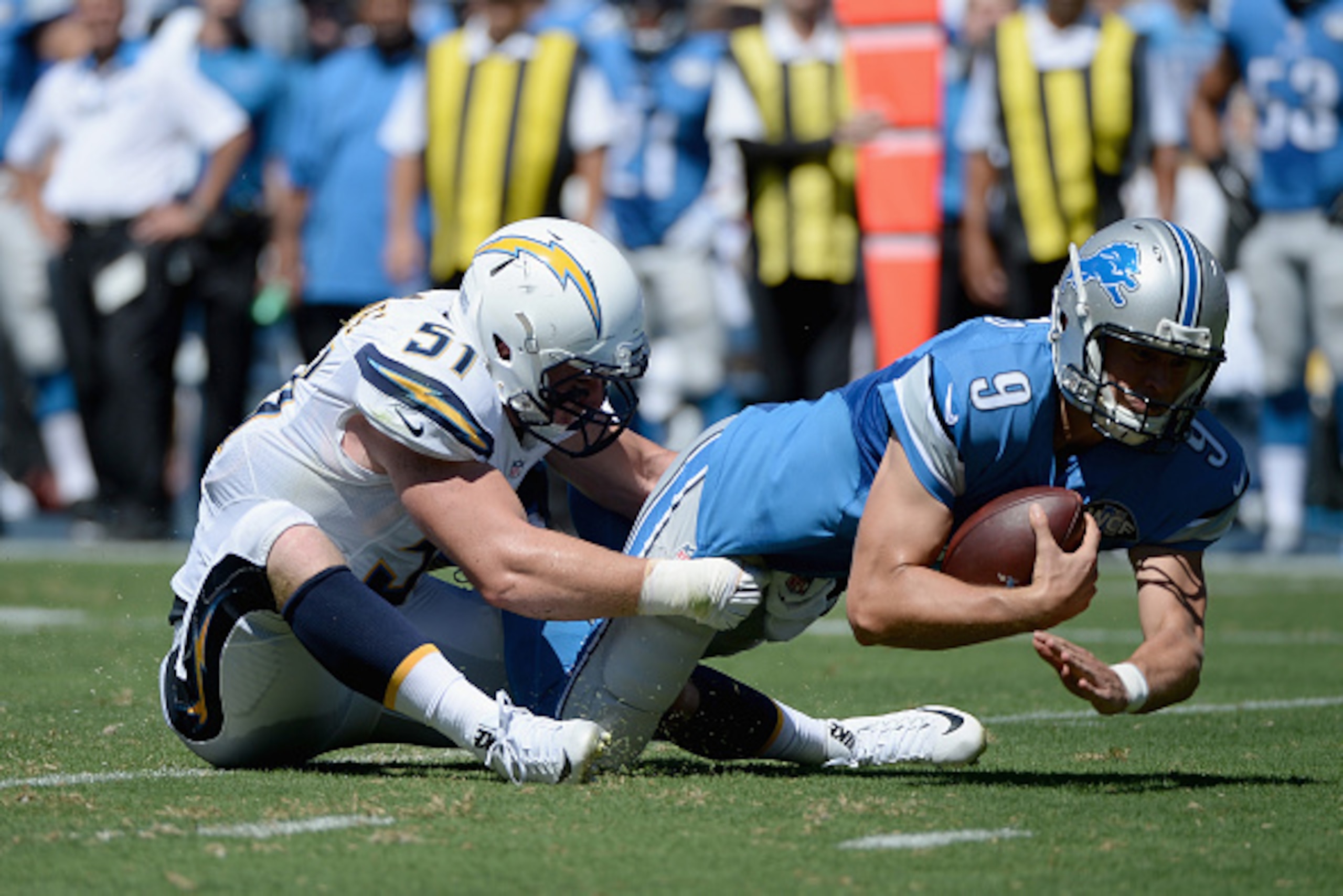 SAN DIEGO, CA - SEPTEMBER 13:  Linebacker Kyle Emanuel #51 of the San Diego Chargers sacks quarterback Matthew Stafford #9 of the Detroit Lions at Qualcomm Stadium on September 13, 2015 in San Diego, California.  (Photo by Donald Miralle/Getty Images)