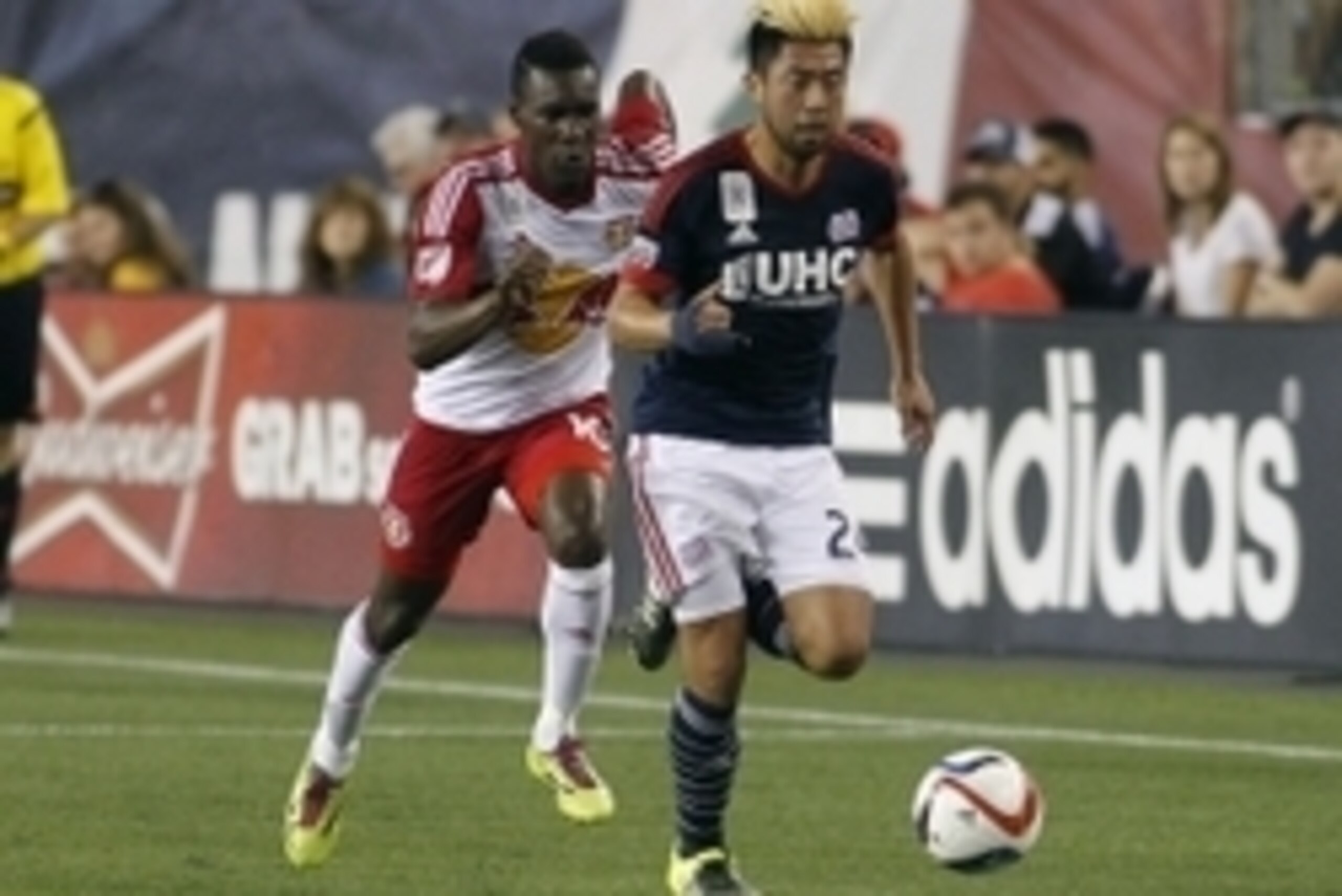 Sep 16, 2015; Foxborough, MA, USA; New York Red Bulls midfielder Lloyd Sam (10) chases down New England Revolution midfielder Lee Nguyen (24) during the second half at Gillette Stadium. Mandatory Credit: Stew Milne-USA TODAY Sports