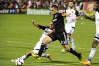 Aug 1, 2015; Washington, DC, USA; D.C. United forward Fabian Espindola (10) dribbles the ball past Real Salt Lake midfielder Luis Gil (10) during the second half at Robert F. Kennedy Memorial. D.C. United won 6 - 4. Mandatory Credit: Brad Mills-USA TODAY Aug 1, 2015; Washington, DC, USA; D.C. United forward Fabian Espindola (10) dribbles the ball past Real Salt Lake midfielder Luis Gil (10) during the second half at Robert F. Kennedy Memorial. D.C. United won 6 - 4. Mandatory Credit: Brad Mills-USA TODAY