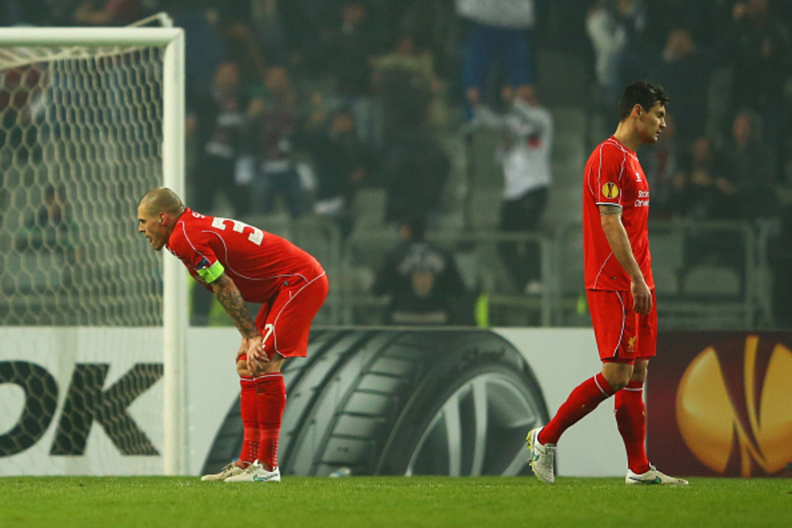 ISTANBUL, TURKEY - FEBRUARY 26: Martin Skrtel (L) and Dejan Lovren of Liverpool look dejected as Omer Arslan of Besiktas scores their first goal during the UEFA Europa League Round of 32 second leg match between Besiktas JK and Liverpool FC on February 2 ISTANBUL, TURKEY - FEBRUARY 26: Martin Skrtel (L) and Dejan Lovren of Liverpool look dejected as Omer Arslan of Besiktas scores their first goal during the UEFA Europa League Round of 32 second leg match between Besiktas JK and Liverpool FC on February 2