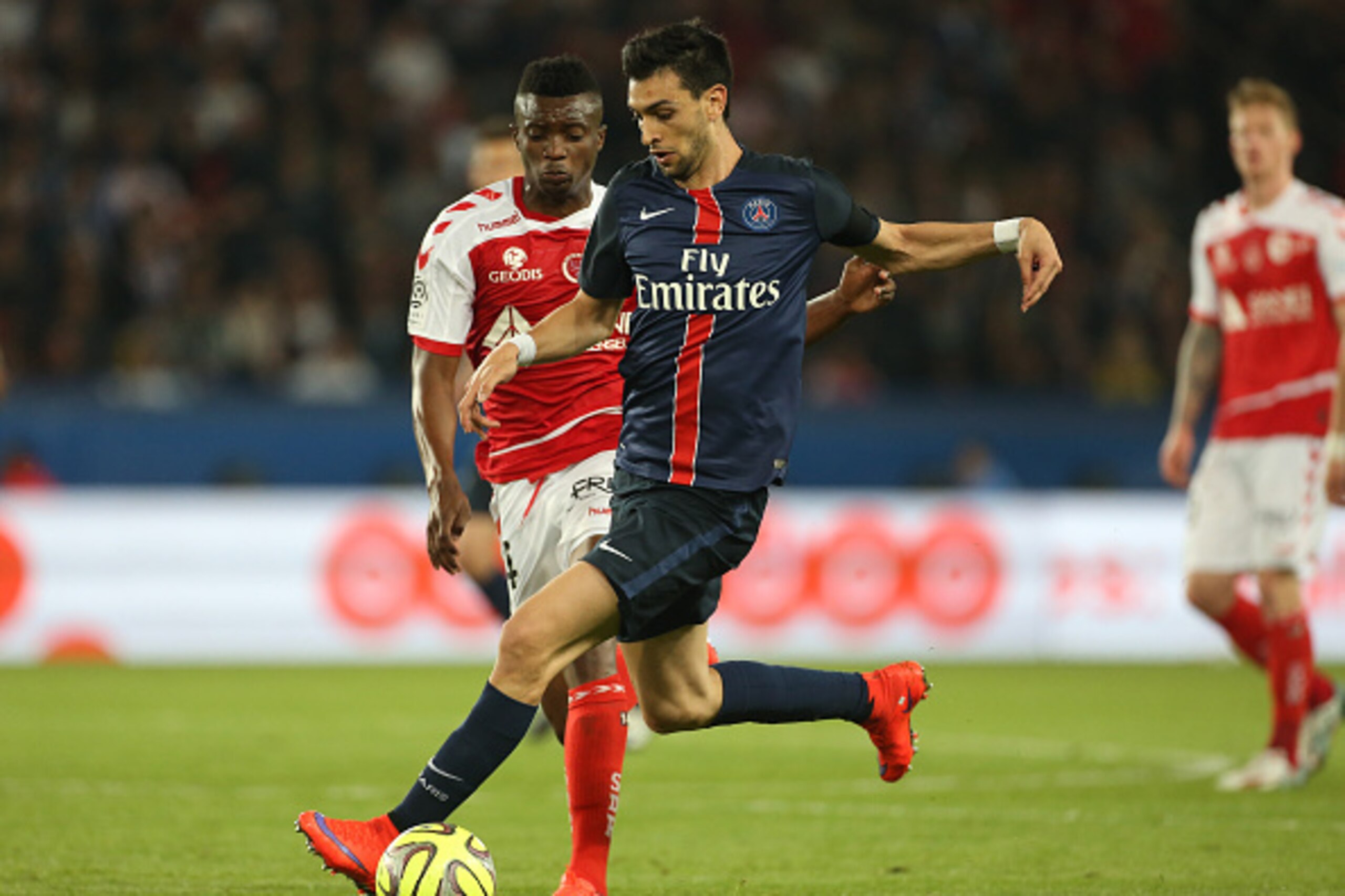 PARIS, FRANCE - MAY 23: Javier Pastore of PSG and Benjamin Moukandjo of Stade de Reims in action during the French Ligue 1 match between Paris Saint-Germain (PSG) and Stade de Reims at Parc des Princes stadium on May 23, 2015 in Paris, France. (Photo by J
