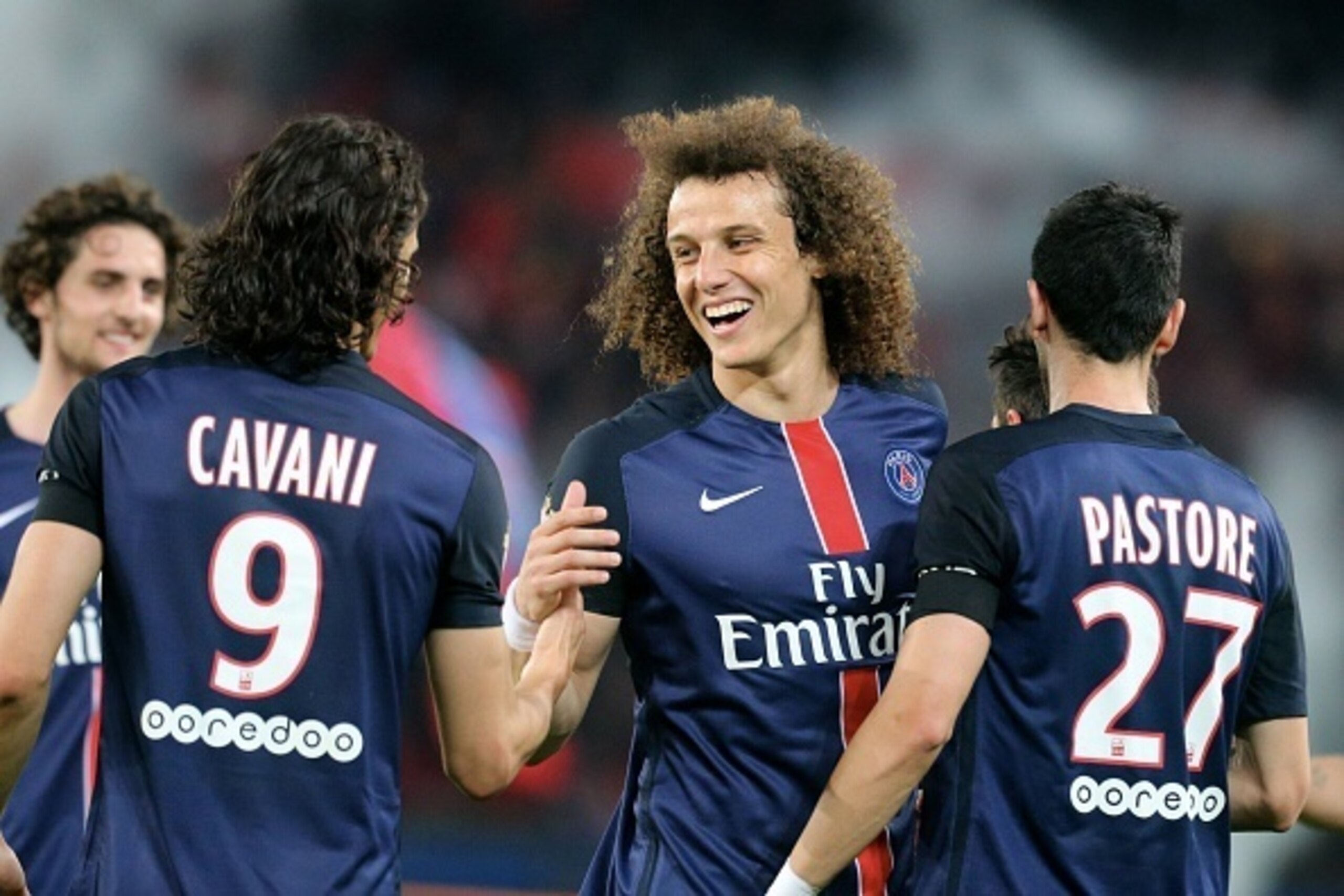 PARIS, FRANCE - MAY 23:  David Luiz of Paris Saint-Germain celebrate a goal by Edinson Cavani during the French  Ligue 1 between Paris Saint-Germain FC and Stade de Reims at Parc Des Princes on may 23, 2015 in Paris, France.  (Photo by Xavier Laine/Getty 