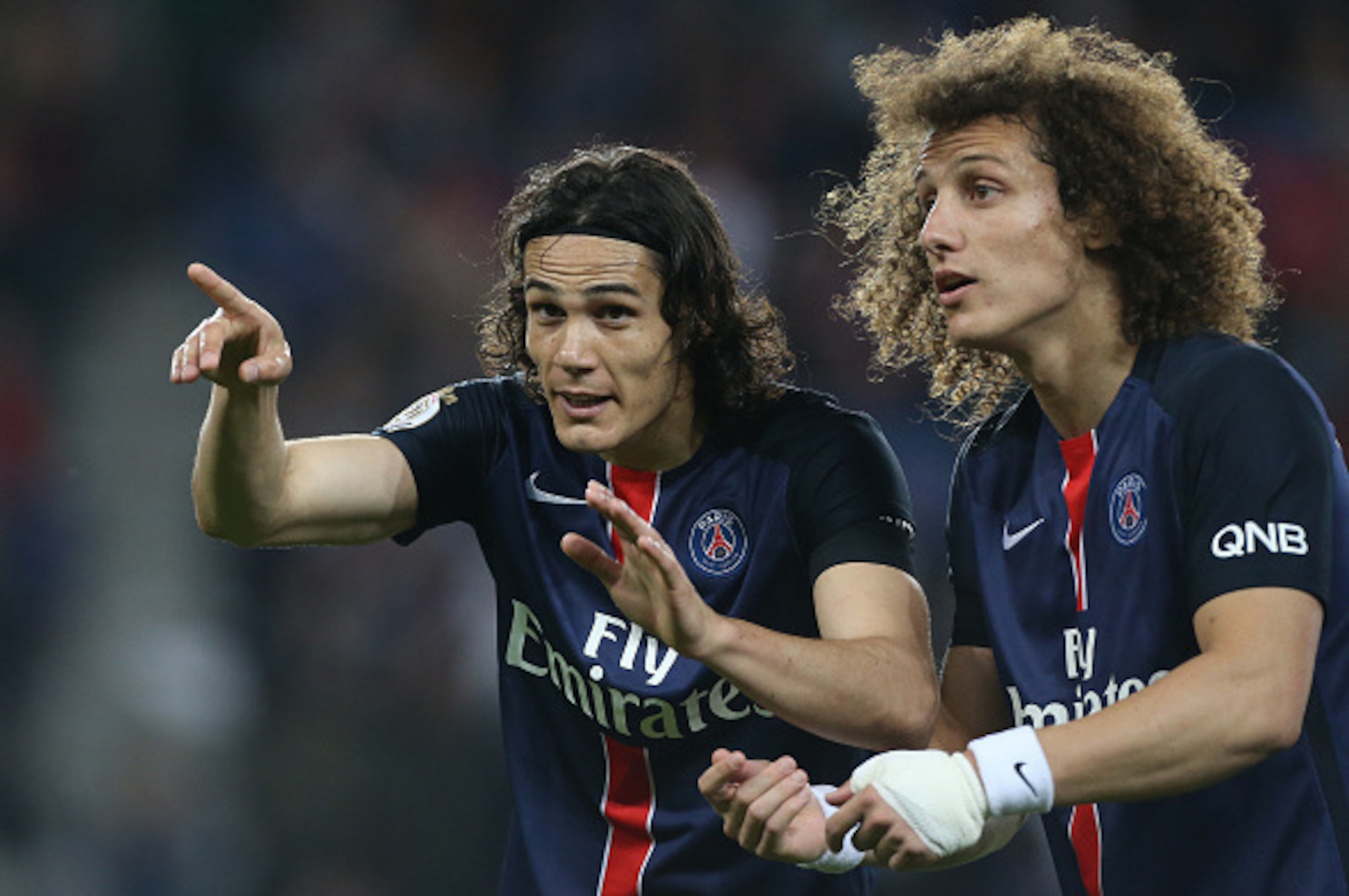 PARIS, FRANCE - MAY 23: Edinson Cavani of PSG celebrates his second goal with David Luiz of PSG during the French Ligue 1 match between Paris Saint-Germain (PSG) and Stade de Reims at Parc des Princes stadium on May 23, 2015 in Paris, France. (Photo by Je