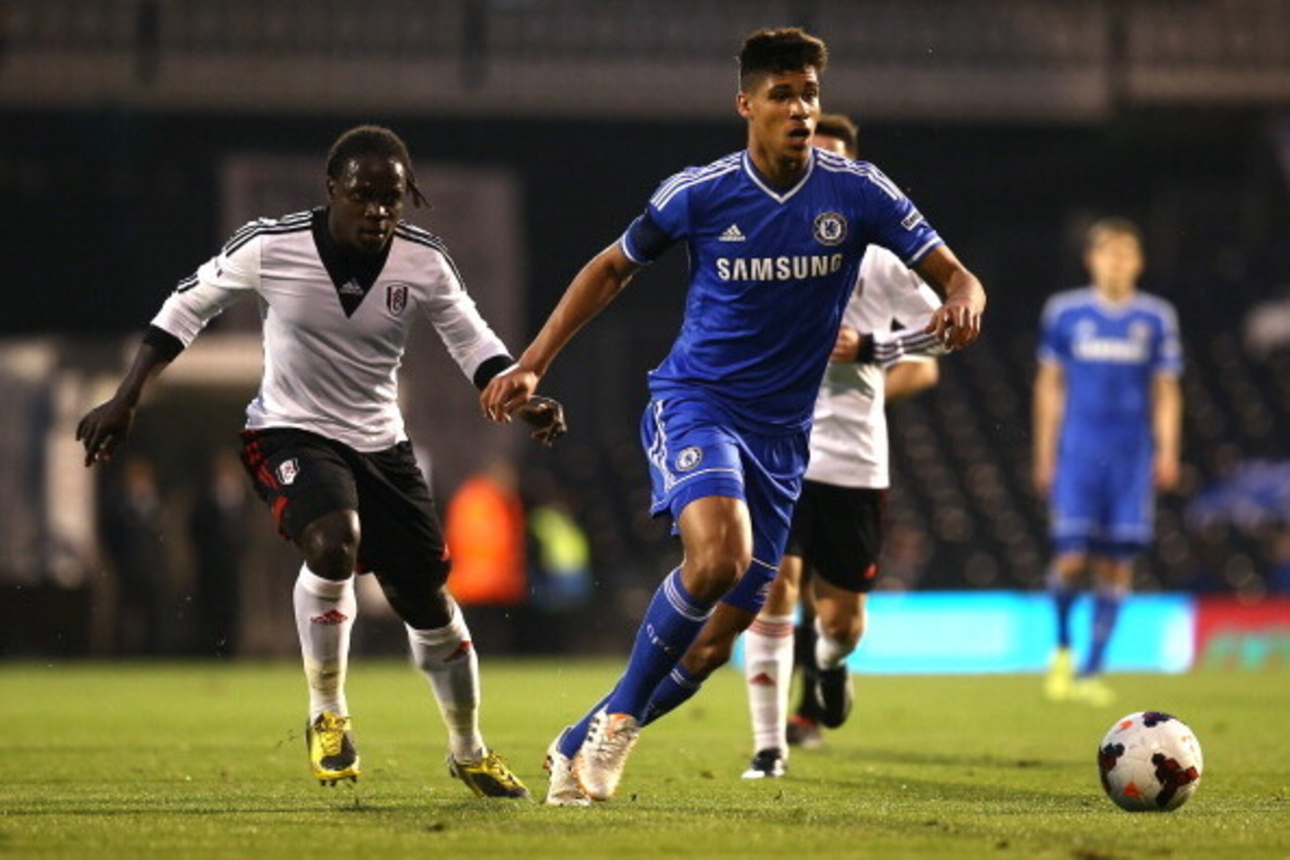 LONDON, ENGLAND - APRIL 28: Ruben Loftus-Cheek of Chelsea holds off Fulham's Solomon Sambou during the FA Youth Cup Final: First Leg match between Fulham and Chelsea at Craven Cottage on April 28, 2014 in London, England. (Photo by Charlie Crowhurst/Getty