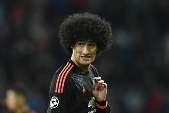 Manchester's Marouane Fellaini reacts during the UEFA Champions League Group B football match between PSV Eindhoven and Manchester United at the Philips stadium in Eindhoven, Belgium on September 15, 2015. AFP PHOTO / JOHN THYS        (Photo credit should
