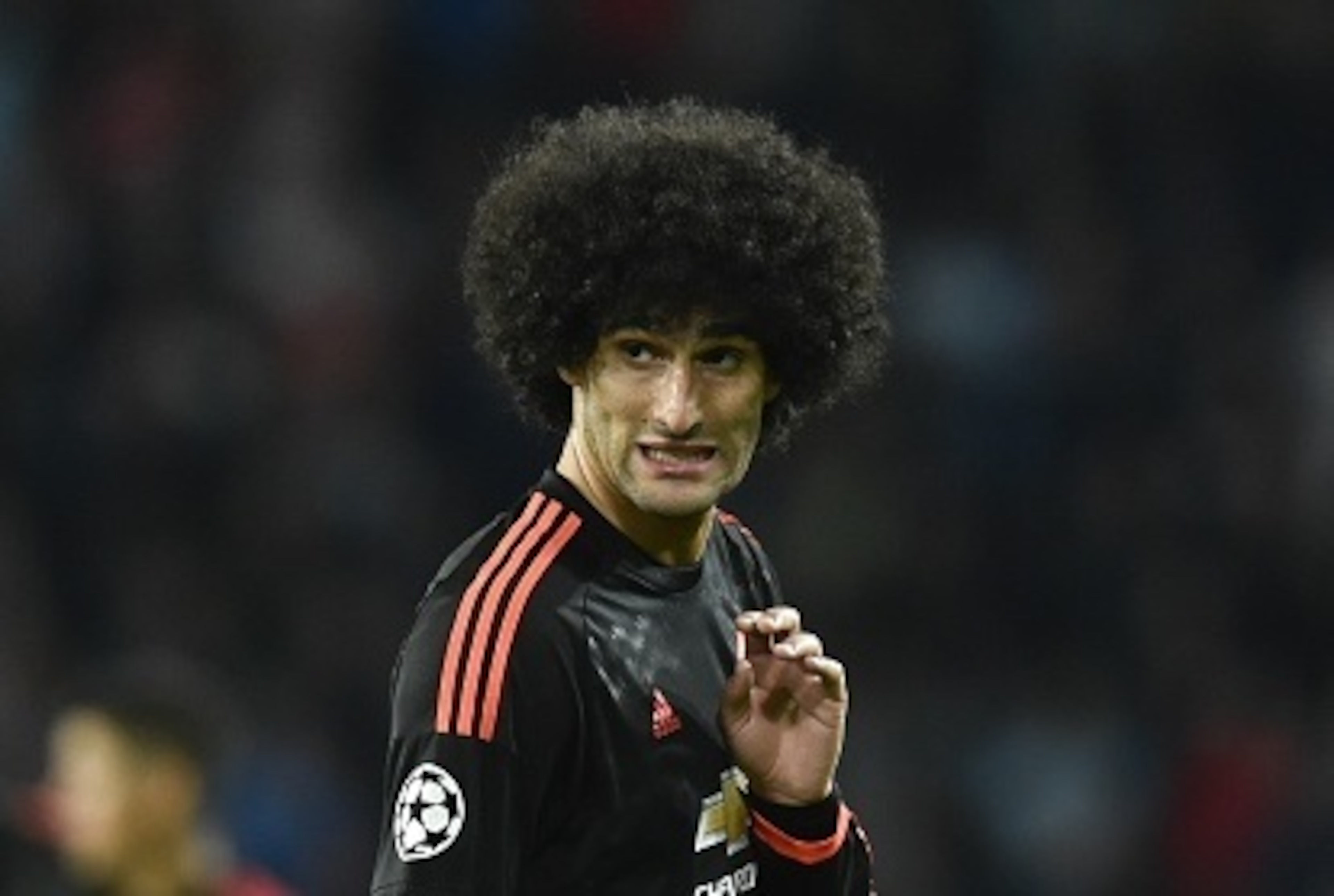 Manchester's Marouane Fellaini reacts during the UEFA Champions League Group B football match between PSV Eindhoven and Manchester United at the Philips stadium in Eindhoven, Belgium on September 15, 2015. AFP PHOTO / JOHN THYS        (Photo credit should