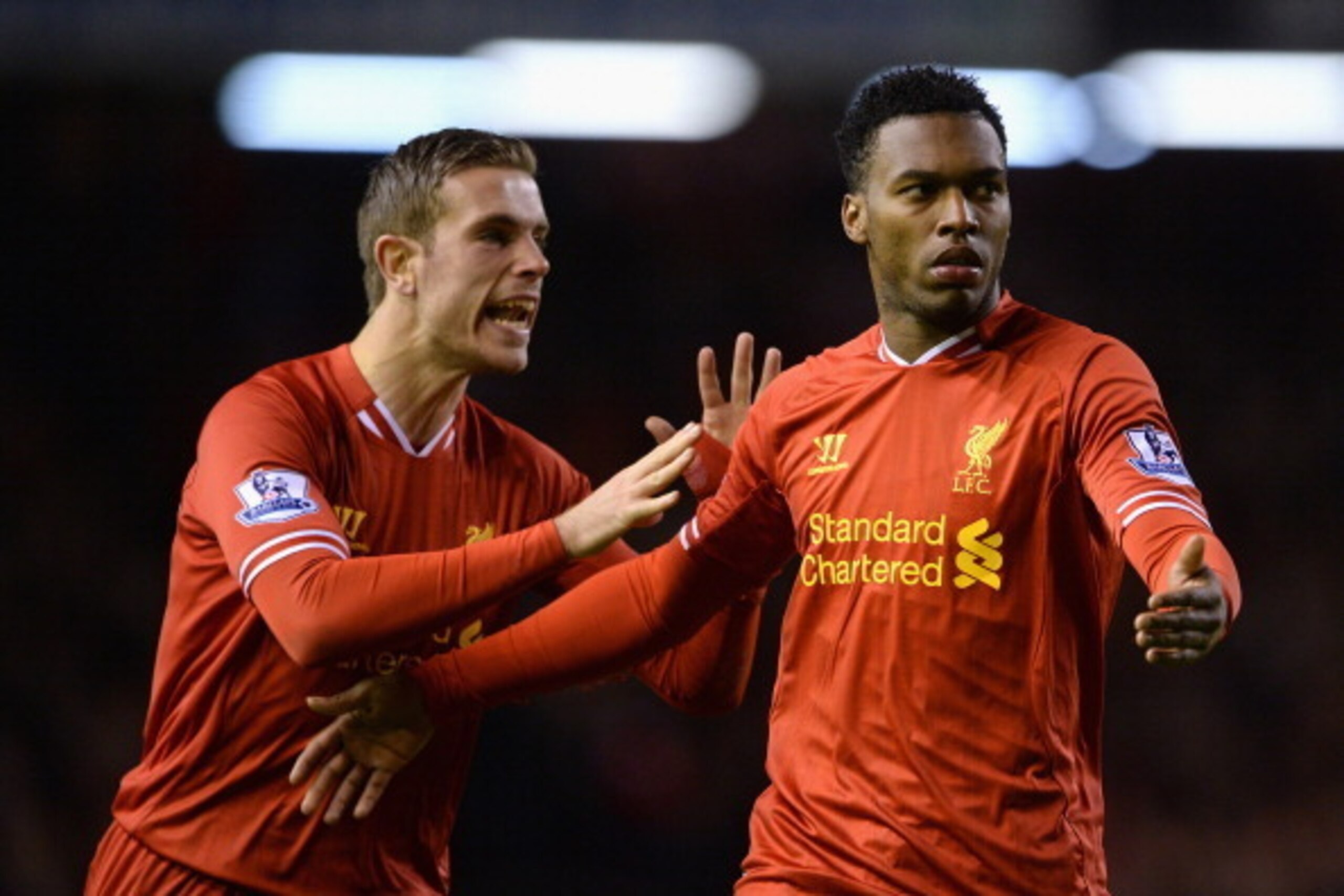 LIVERPOOL, ENGLAND - MARCH 26:  Daniel Sturridge of Liverpool celebrates scoring the second goal with team-mate Jordan Henderson (l) during the Barclays Premier League match between Liverpool and Sunderland at Anfield on March 26, 2014 in Liverpool, Engla