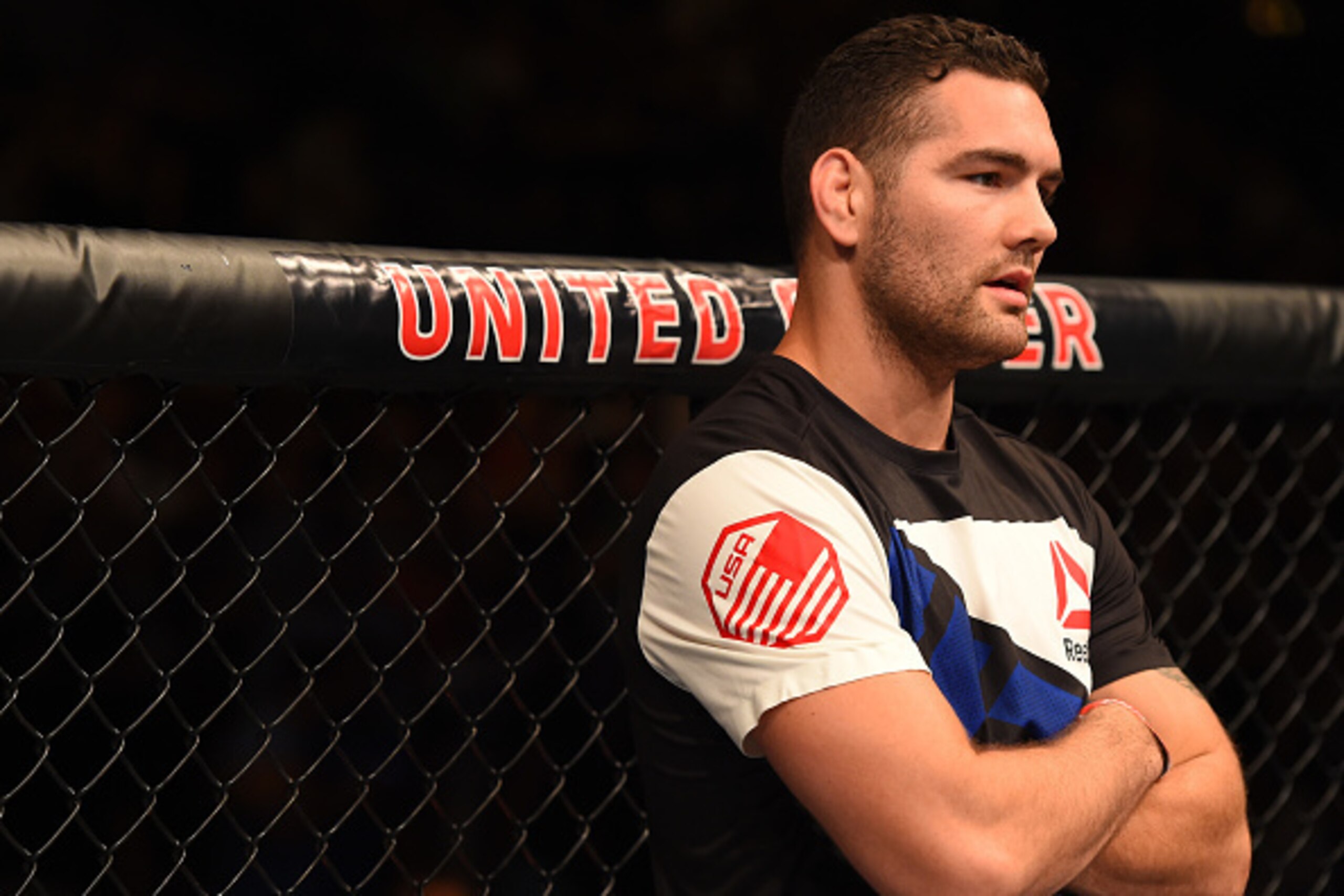 CHICAGO, IL - JULY 25:   UFC middleweight champion Chris Weidman reacts after his teammate Gian Villante's TKO loss to Tom Lawlor in their light heavyweight bout during the UFC event at the United Center on July 25, 2015 in Chicago, Illinois. (Photo by Je