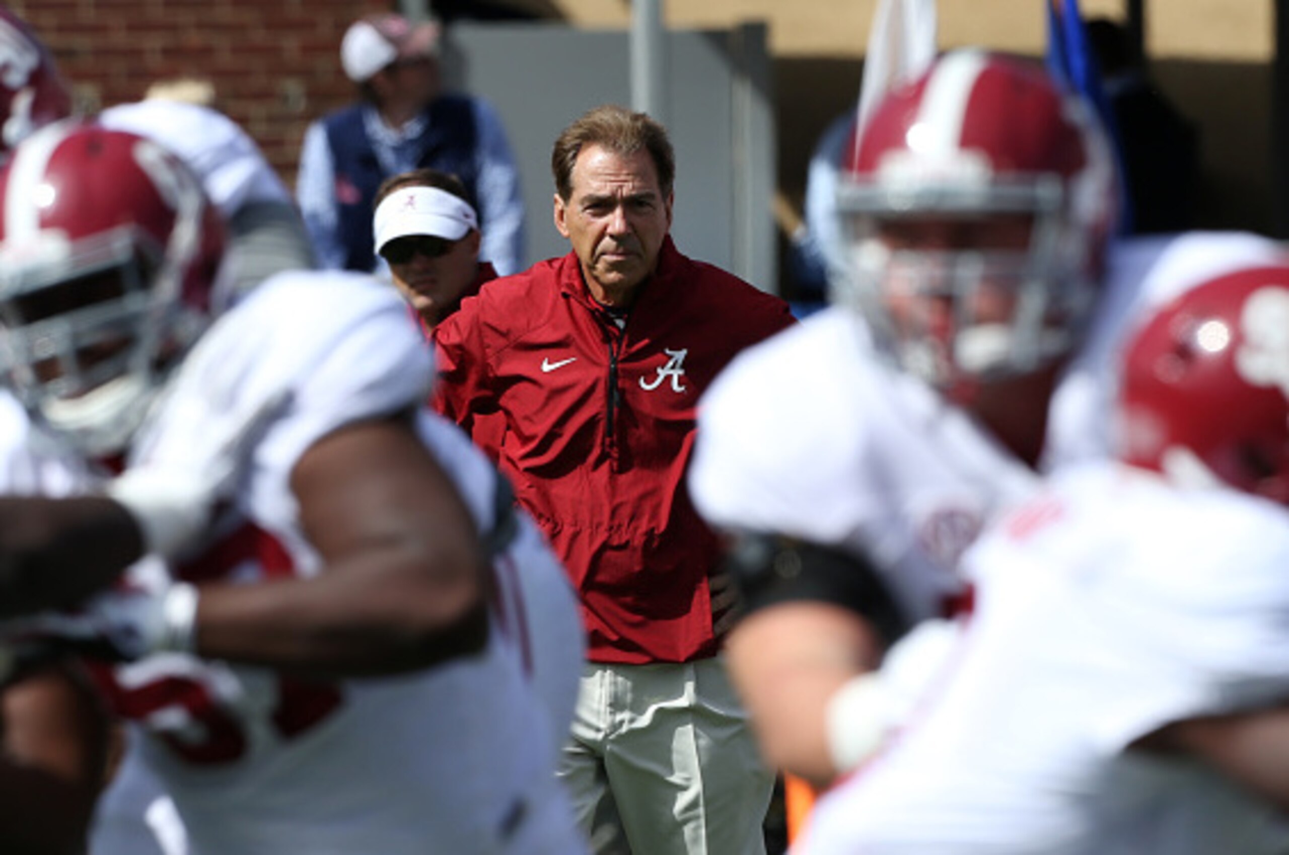 OXFORD, MS - OCTOBER 4: Nick Saban, head coach of the Alabama Crimson Tide watches warmups before a game against the Ole Miss Rebels on October 4, 2014 at Vaught-Hemingway Stadium in Oxford, Mississippi. (Photo by Joe Murphy/Getty Images) OXFORD, MS - OCTOBER 4: Nick Saban, head coach of the Alabama Crimson Tide watches warmups before a game against the Ole Miss Rebels on October 4, 2014 at Vaught-Hemingway Stadium in Oxford, Mississippi. (Photo by Joe Murphy/Getty Images)