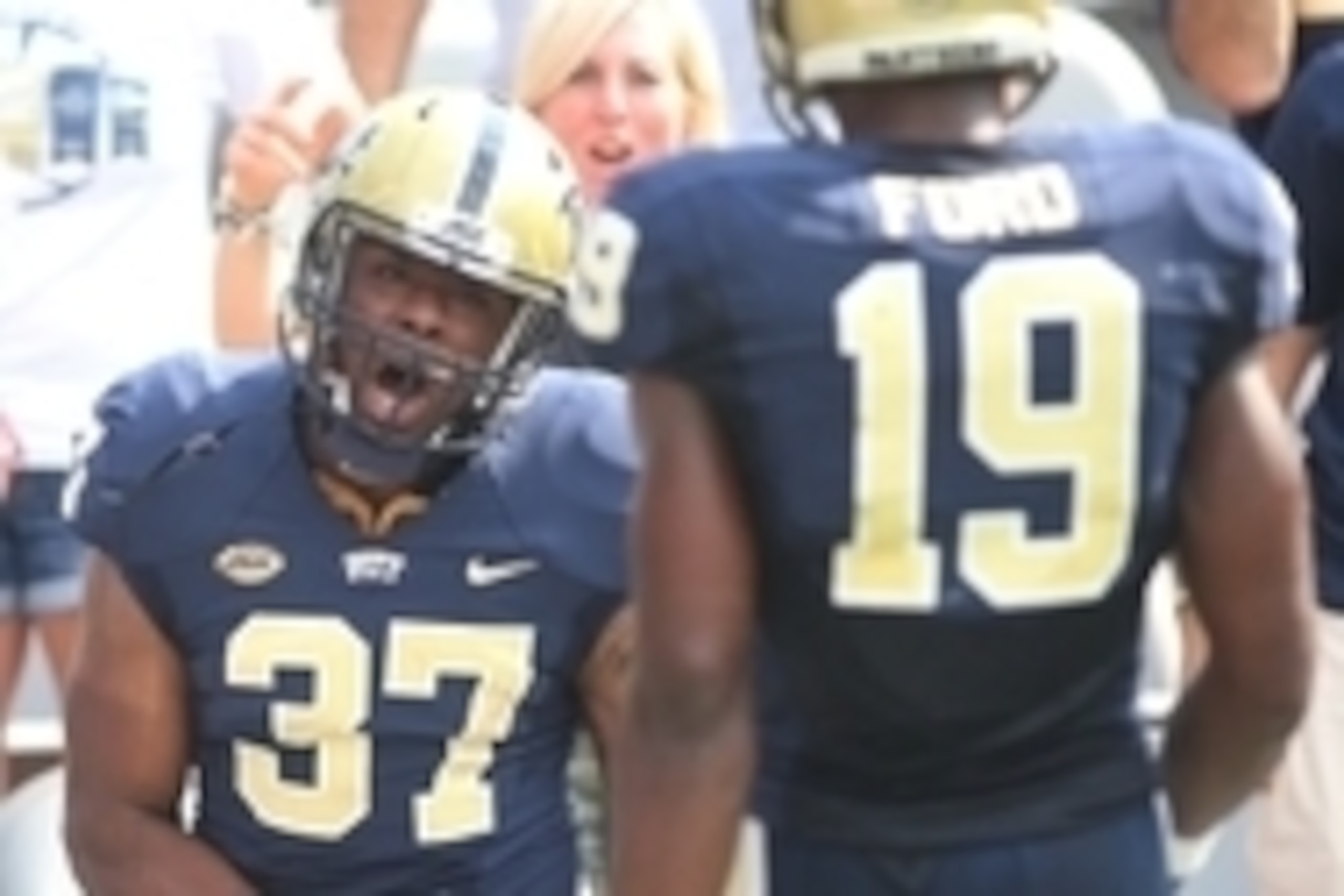 Sep 5, 2015; Pittsburgh, PA, USA; Pittsburgh Panthers running back Qadree Ollison (37) celebrates with wide receiver Dontez Ford (19) after scoring a seventy-one yard touchdown against the Youngstown State Penguinsduring the second half at Heinz Field. Th