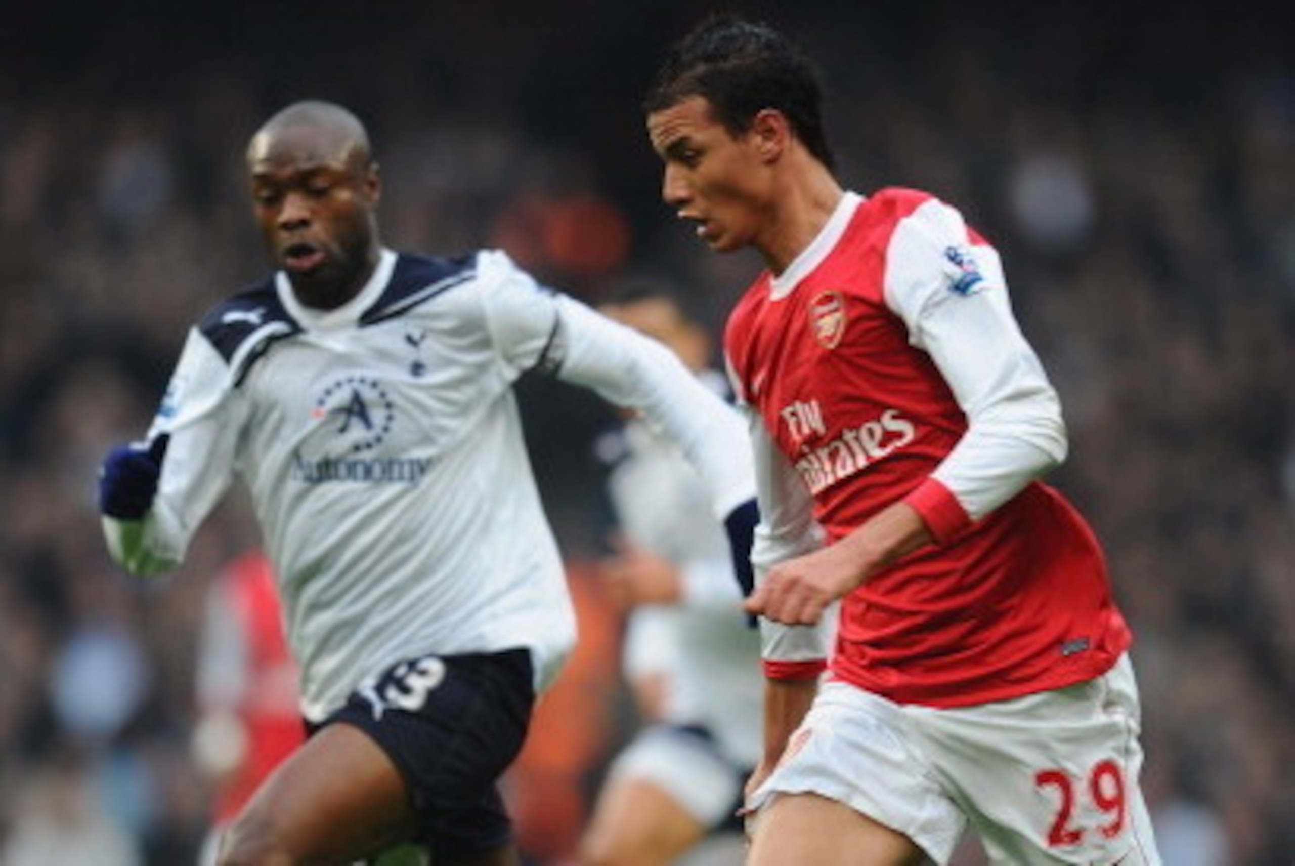 LONDON, ENGLAND - NOVEMBER 20:  Marouane Chamakh of Arsenal gets away from William Gallas of Tottenham during the Barclays Premier League match between Arsenal and Tottenham Hotspur at the Emirates Stadium on November 20, 2010 in London, England.  (Photo