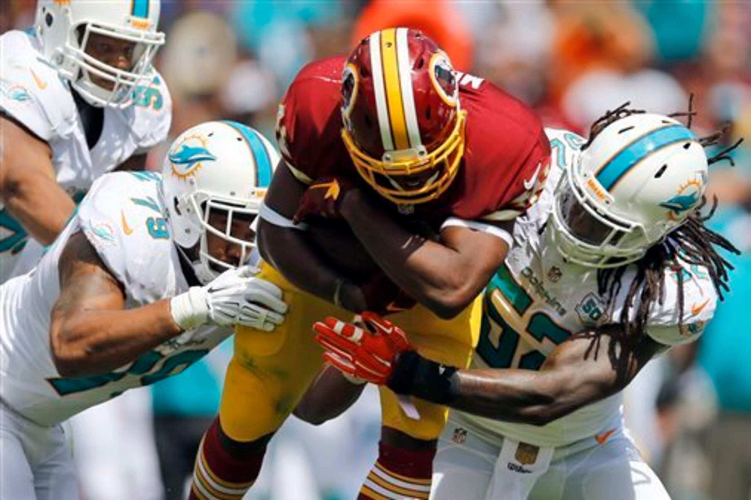 Kelvin Sheppard tackling Alfred Morris