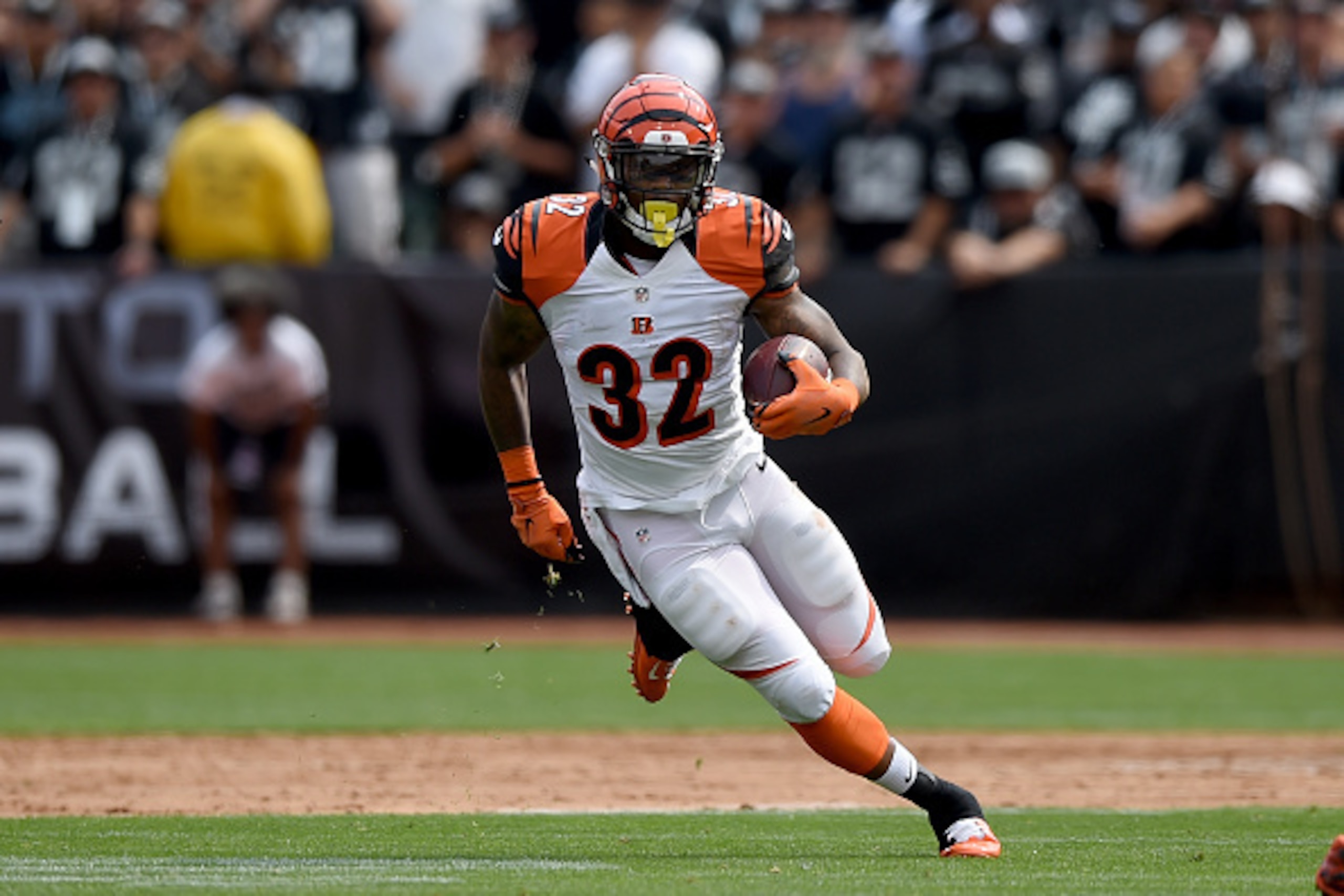 OAKLAND, CA - SEPTEMBER 13:  Jeremy Hill #32 of the Cincinnati Bengals carries the ball against the Oakland Raiders during their NFL game at the O.co Coliseum on September 13, 2015 in Oakland, California.  (Photo by Thearon W. Henderson/Getty Images)