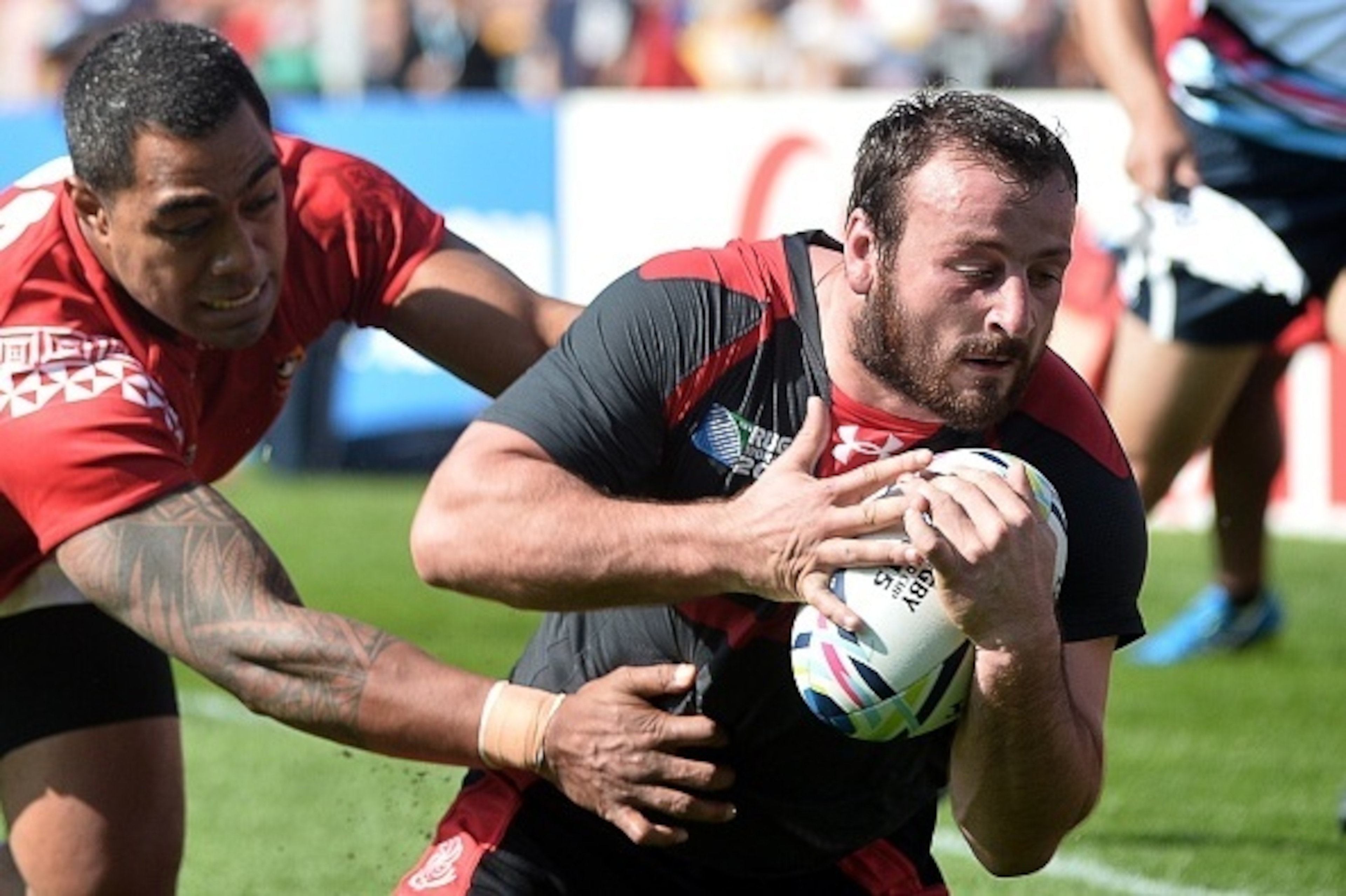 Georgia's flanker Giorgi Tkhilaishvili (R) runs to score a try during a Pool C match of the 2015 Rugby World Cup between Tonga and Georgia at Kingsholm stadium in Gloucester, west England, on September 19, 2015. AFP PHOTO / BERTRAND LANGLOIS
RESTRICTED Georgia's flanker Giorgi Tkhilaishvili (R) runs to score a try during a Pool C match of the 2015 Rugby World Cup between Tonga and Georgia at Kingsholm stadium in Gloucester, west England, on September 19, 2015. AFP PHOTO / BERTRAND LANGLOIS
RESTRICTED