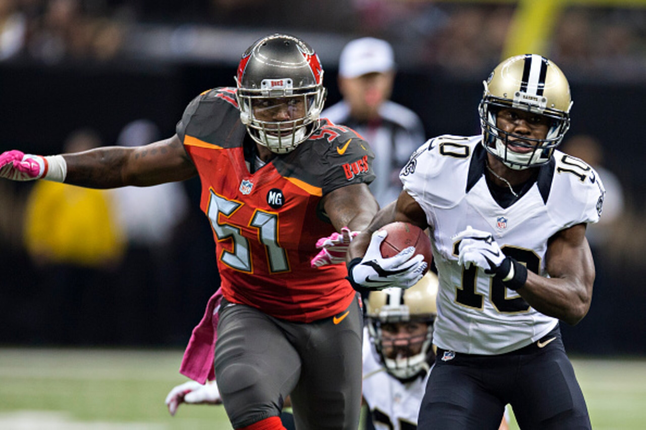 NEW ORLEANS, LA - OCTOBER 5:  Brandin Cooks #10 of the New Orleans Saints runs away from Danny Lansanah #51 of the Tampa Bay Buccaneers at Mercedes-Benz Superdome on October 5, 2014 in New Orleans, Louisiana.  The Saints defeated the Buccaneers 37-31.  (P