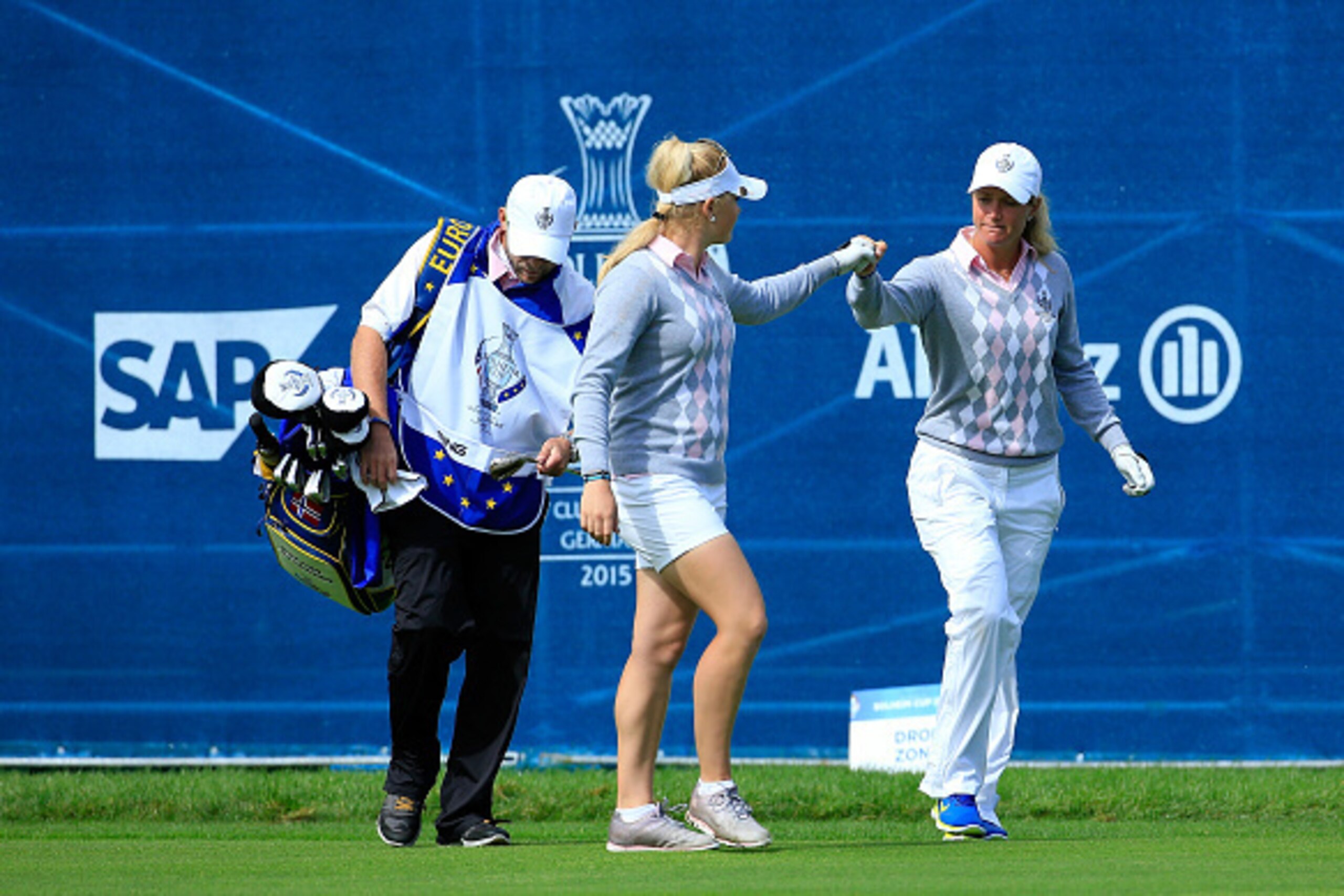 SANKT LEON-ROT, GERMANY - SEPTEMBER 19:  Charley Hull (l) of the European Team congratulates her partner Suzann Pettersen after Pettersen had put their third shot close on the 16th hole in their match against Paula Creamer and Morgan Pressel by 1 hole dur