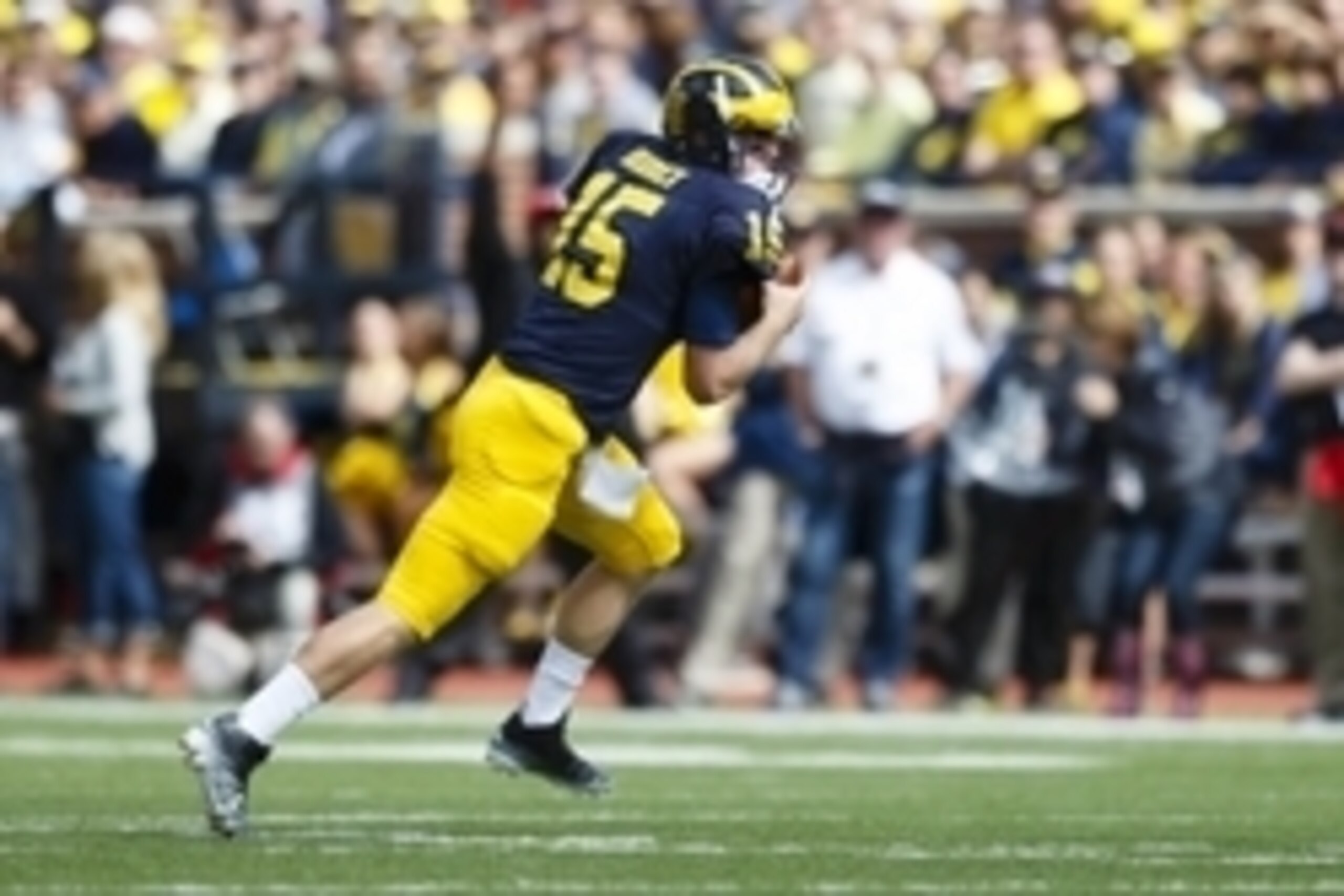 Sep 19, 2015; Ann Arbor, MI, USA; Michigan Wolverines quarterback Jake Rudock (15) scrambles in the first quarter against the UNLV Rebels at Michigan Stadium. Mandatory Credit: Rick Osentoski-USA TODAY Sports
