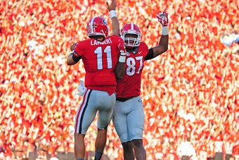 ATHENS, GA - SEPTEMBER 19: Greyson Lambert #11 of the Georgia Bulldogs celebrates with Jay Rome #87 after a second quarter touchdown against South Carolina Gamecocks on September 19, 2015 in Atlanta, Georgia. Photo by Scott Cunningham/Getty Images)