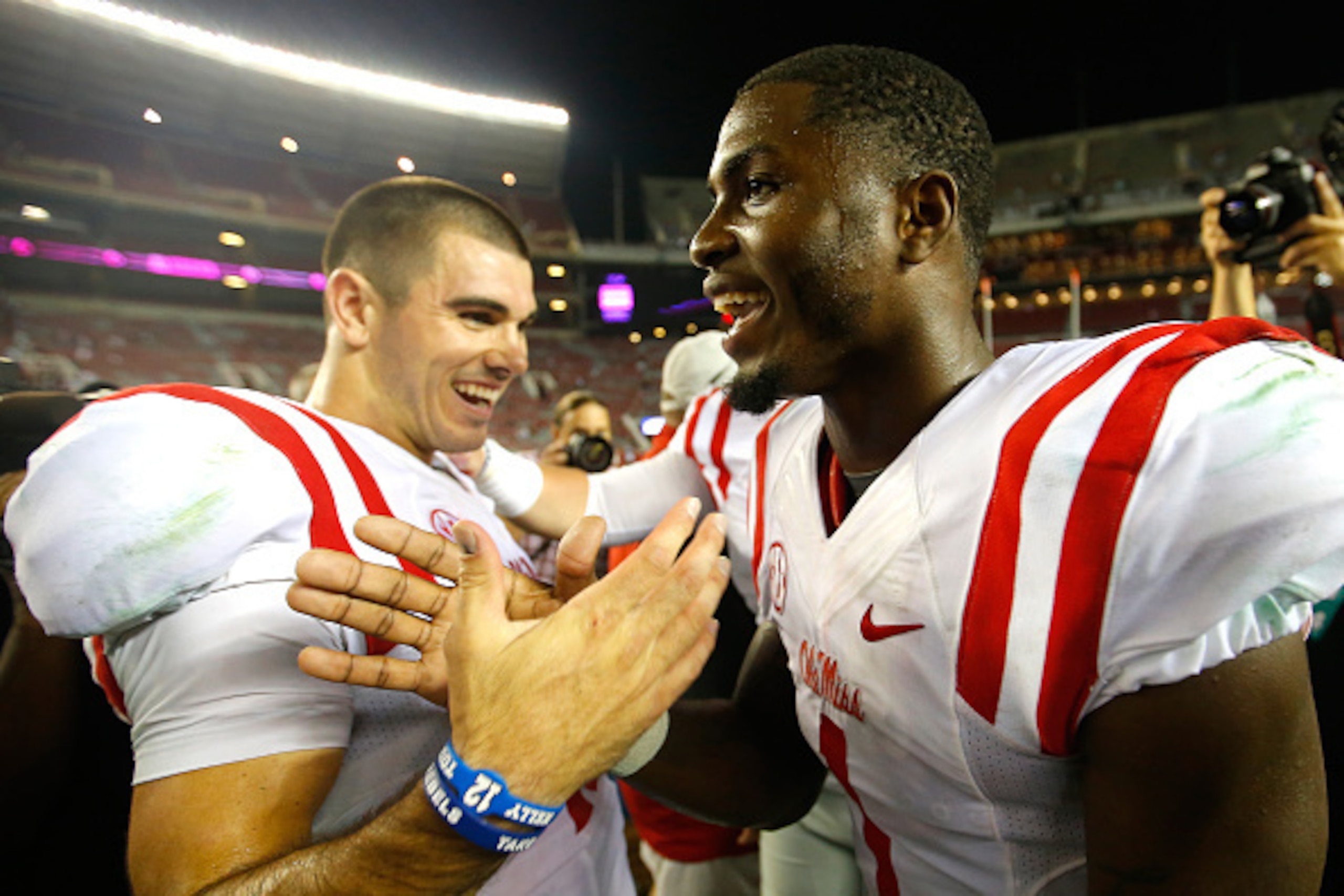 TUSCALOOSA, AL - SEPTEMBER 19:  Chad Kelly #10 and Laquon Treadwell #1 of the Mississippi Rebels celebrate their 43-37 win over the Alabama Crimson Tide at Bryant-Denny Stadium on September 19, 2015 in Tuscaloosa, Alabama.  (Photo by Kevin C. Cox/Getty Im