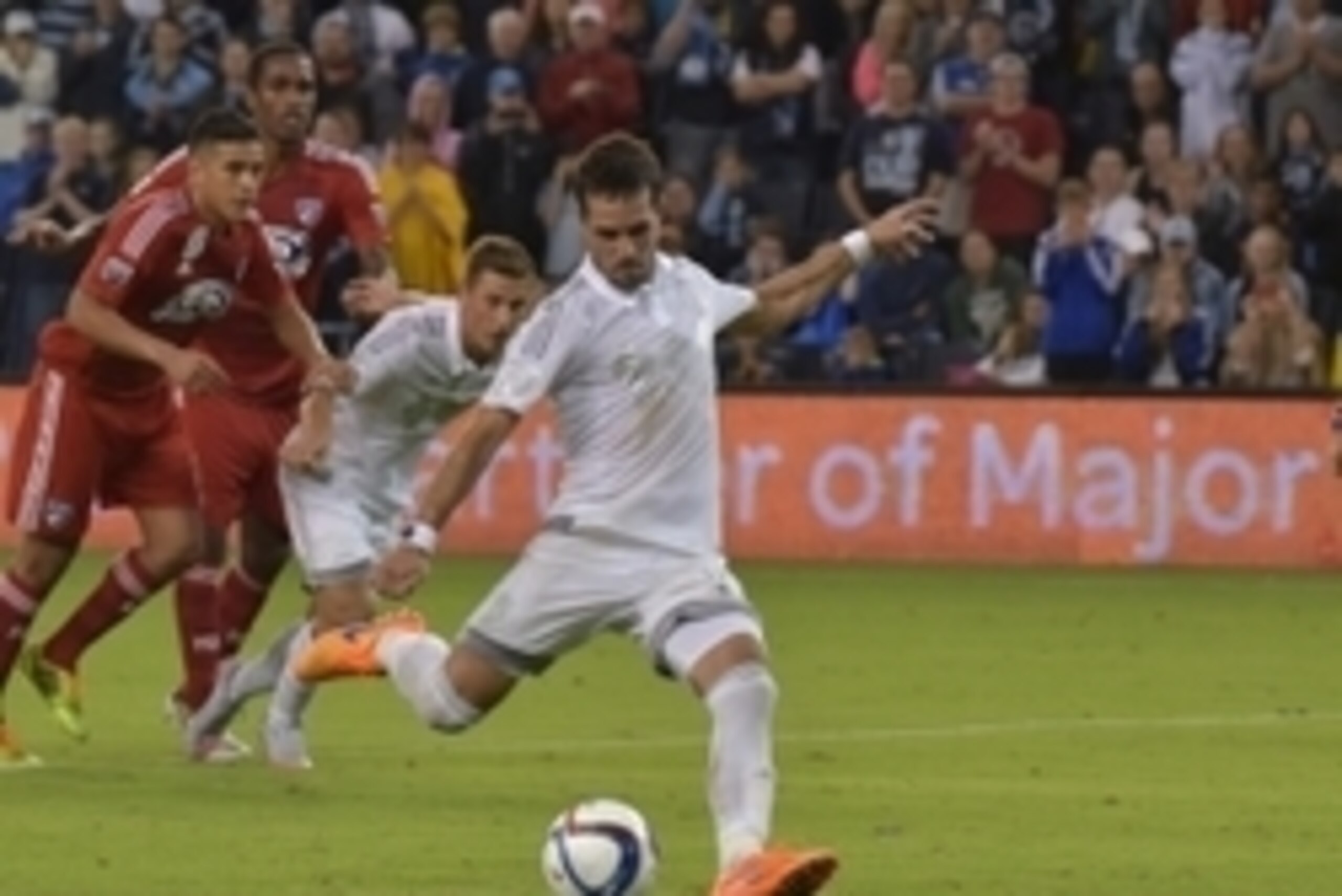 Sep 18, 2015; Kansas City, KS, USA; Sporting KC midfielder Benny Feilhaber (10) scores a goal on a penalty kick during the second half of the match against FC Dallas at Sporting Park. Sporting KC won 3-1. Mandatory Credit: Denny Medley-USA TODAY Sports