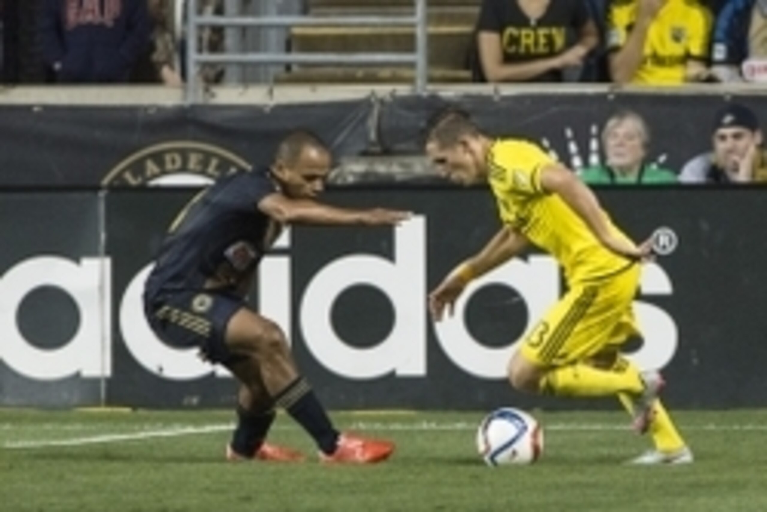 Sep 12, 2015; Philadelphia, PA, USA;  Columbus Crew midfielder Ethan Finlay (13)  dribbles as Philadelphia Union defender Fabinho (33) defends during the second half at PPL Park. Columbus Crew defeated Philadelphia Union 2-1. Mandatory Credit: Tommy Gilli
