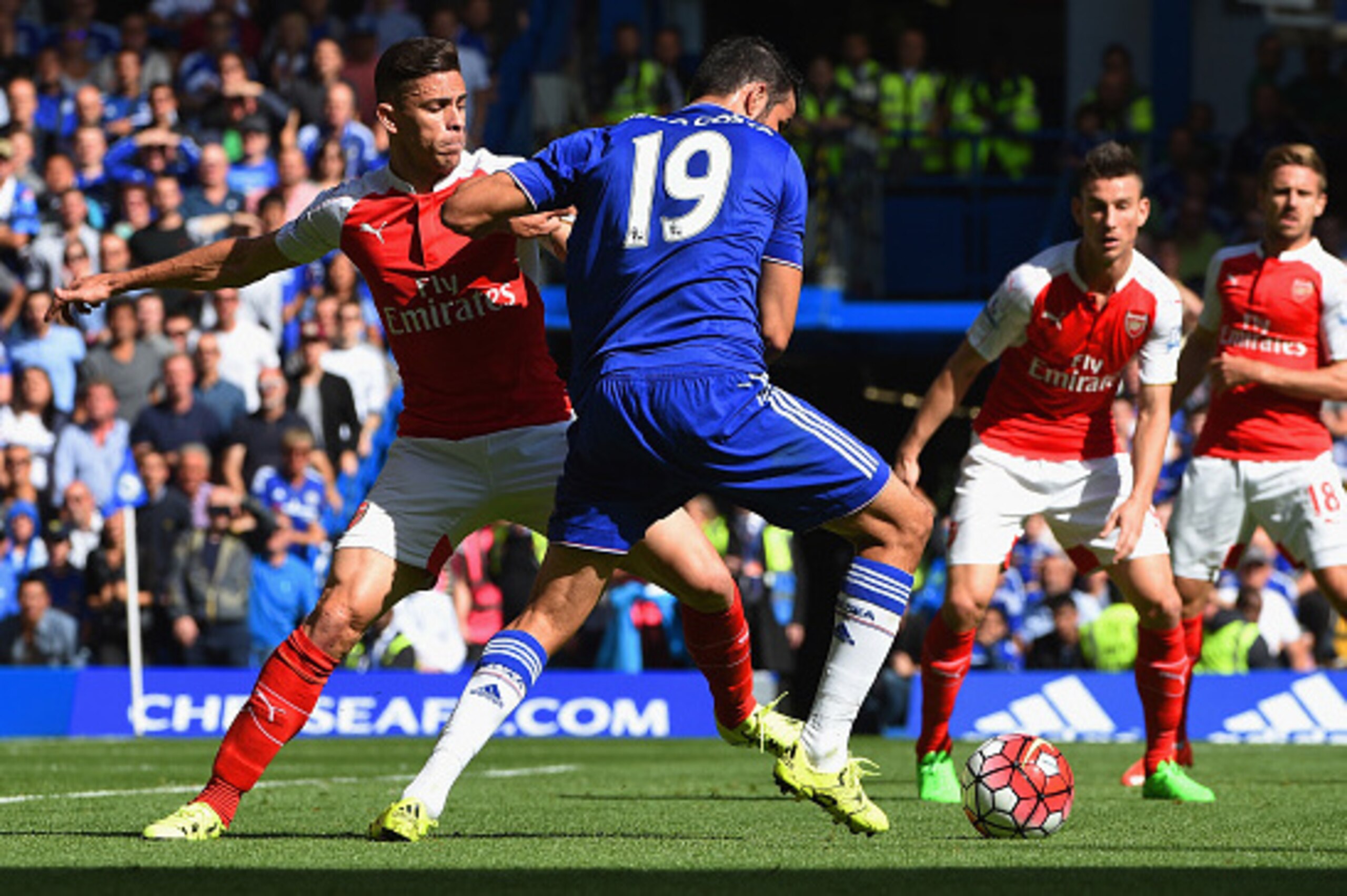 LONDON, ENGLAND - SEPTEMBER 19: Diego Costa of Chelsea and Gabriel of Arsenal compete for the ball during the Barclays Premier League match between Chelsea and Arsenal at Stamford Bridge on September 19, 2015 in London, United Kingdom.  (Photo by Ross Kin