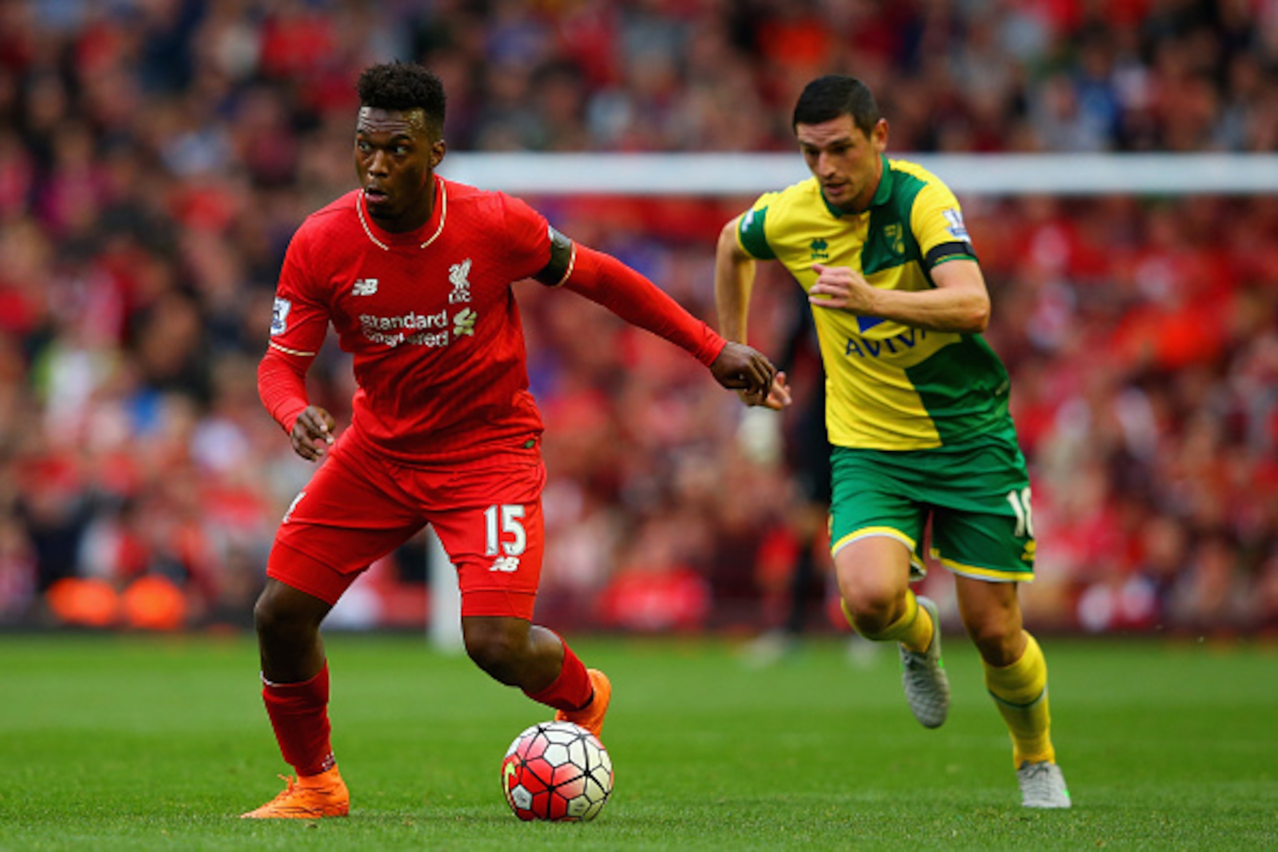 LIVERPOOL, ENGLAND - SEPTEMBER 20: Daniel Sturridge of Liverpool breaks away from Graham Dorrans of Norwich City  during the Barclays Premier League match between Liverpool and Norwich City at Anfield on September 20, 2015 in Liverpool, United Kingdom.  (