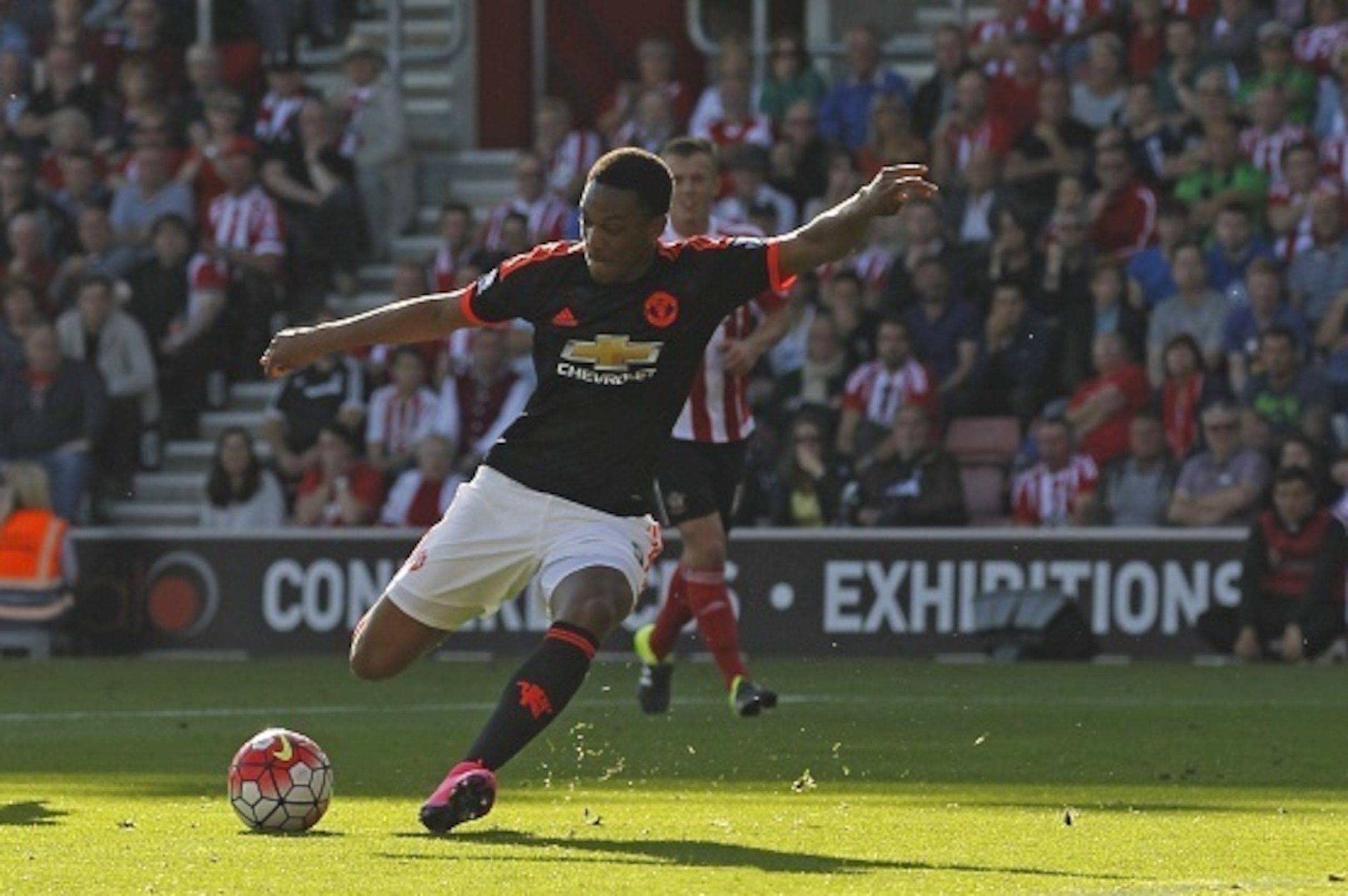 Manchester United's French striker Anthony Martial shoots to score their first goal during the English Premier League football match between Southampton and Manchester United at St Mary's Stadium in Southampton, southern England on September 20, 2015. AFP