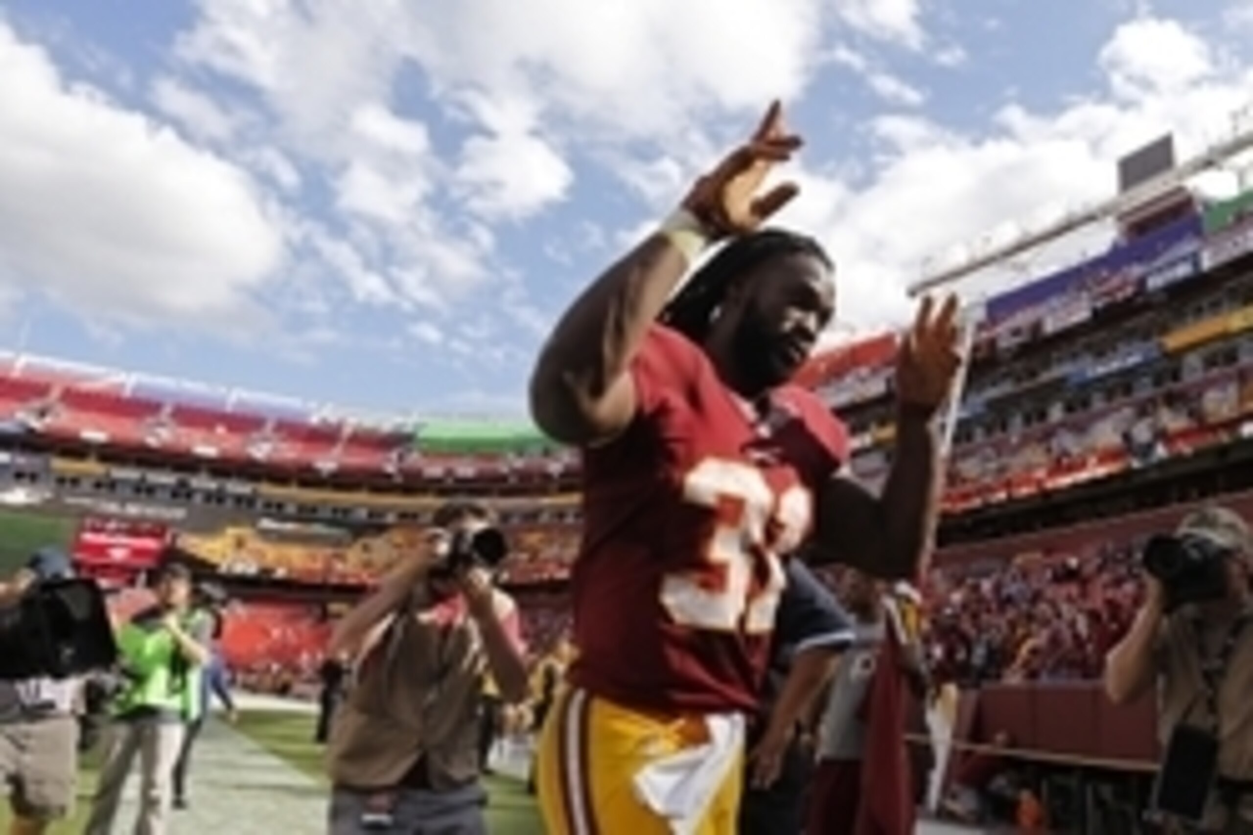 Sep 20, 2015; Landover, MD, USA; Washington Redskins running back Matt Jones (31) celebrates while leaving the field after the Redskins' game against the St. Louis Rams at FedEx Field. The Redskins won 24-10. Mandatory Credit: Geoff Burke-USA TODAY Sports