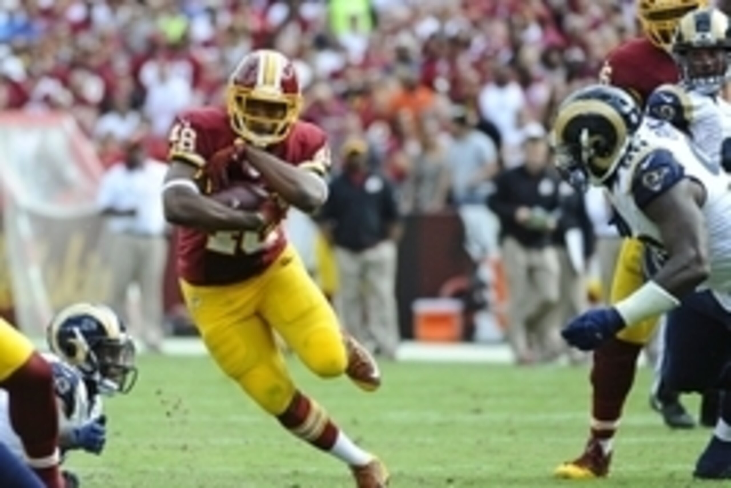Sep 20, 2015; Landover, MD, USA; Washington Redskins running back Alfred Morris (46) carries the ball as St. Louis Rams defensive tackle Michael Brockers (90) defends during the second half at FedEx Field. The Washington Redskins won 24 - 10. Mandatory Cr