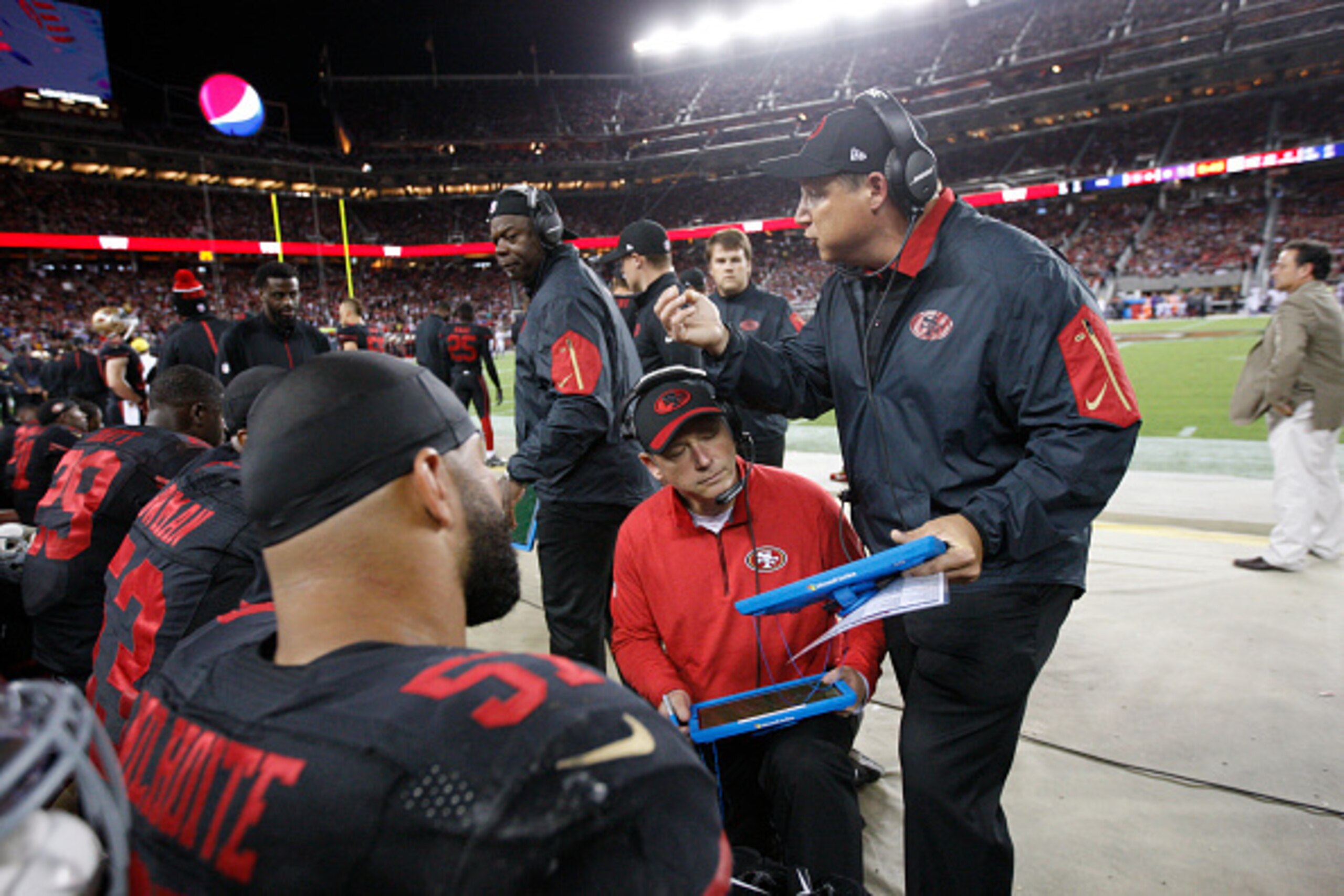 SANTA CLARA, CA - SEPTEMBER 14: Defensive Coordinator Eric Mangini and Linebackers Coach Clancy Pendergast of the San Francisco 49ers talk with the linebackers on the field during the game against the Minnesota Vikings at Levi Stadium on September 14, 201