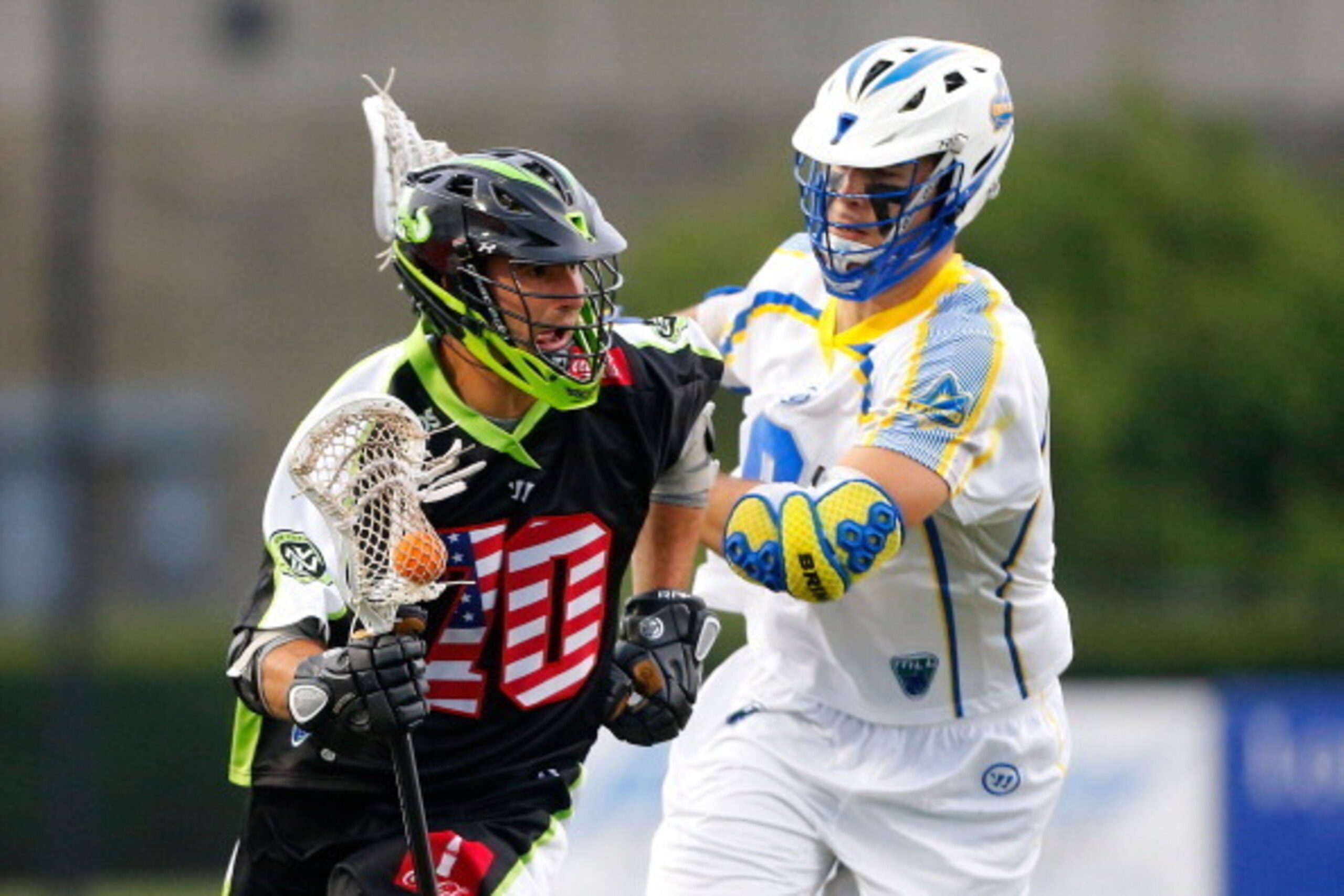UNIONDALE, NY - JULY 03:  Steve DeNapoli #70 of the New York Lizards in action against Garrett Thul #9 of the Florida Launch during their Major League Lacrosse game at Shuart Stadium on July 3, 2014  in Uniondale, New York. The Lizards defeated the Launch