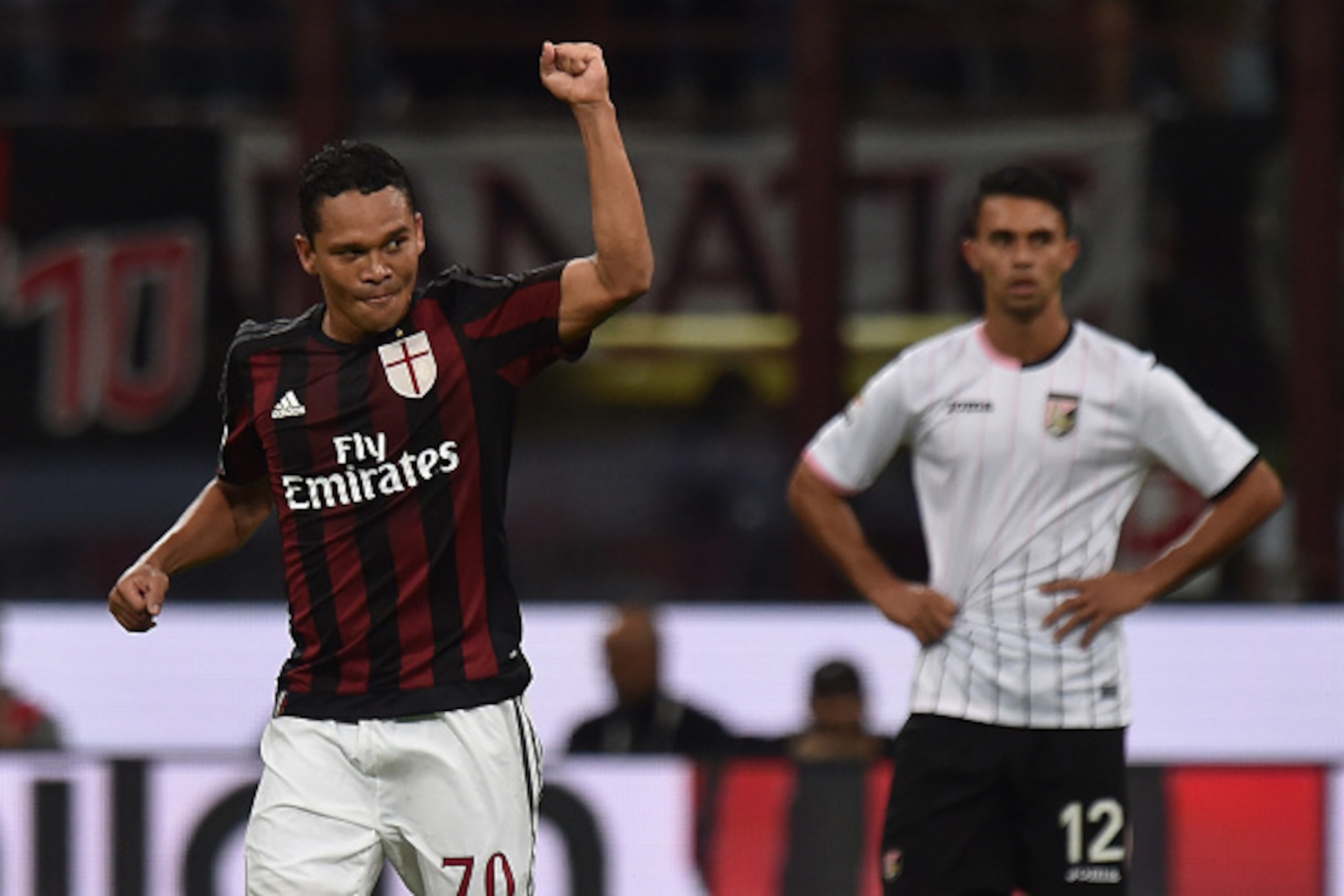MILAN, ITALY - SEPTEMBER 19:  Carlos Bacca (L) of Milan celebrates after scoring the opening goal during the Serie A match between AC Milan and US Citta di Palermo at Stadio Giuseppe Meazza on September 19, 2015 in Milan, Italy.  (Photo by Tullio M. Pugli