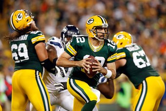 GREEN BAY, WI - SEPTEMBER 20:  Aaron Rodgers #12 of the Green Bay Packers looks to throw a pass in the second quarter against the Seattle Seahawks during their game at Lambeau Field on September 20, 2015 in Green Bay, Wisconsin.  (Photo by Christian Peter