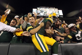 GREEN BAY, WI - SEPTEMBER 20:  James Jones #89 of the Green Bay Packers celebrates with fans after scoring a touchdown thrown by Aaron Rodgers #12 in the first quarter against the Seattle Seahawks during their game at Lambeau Field on September 20, 2015 i