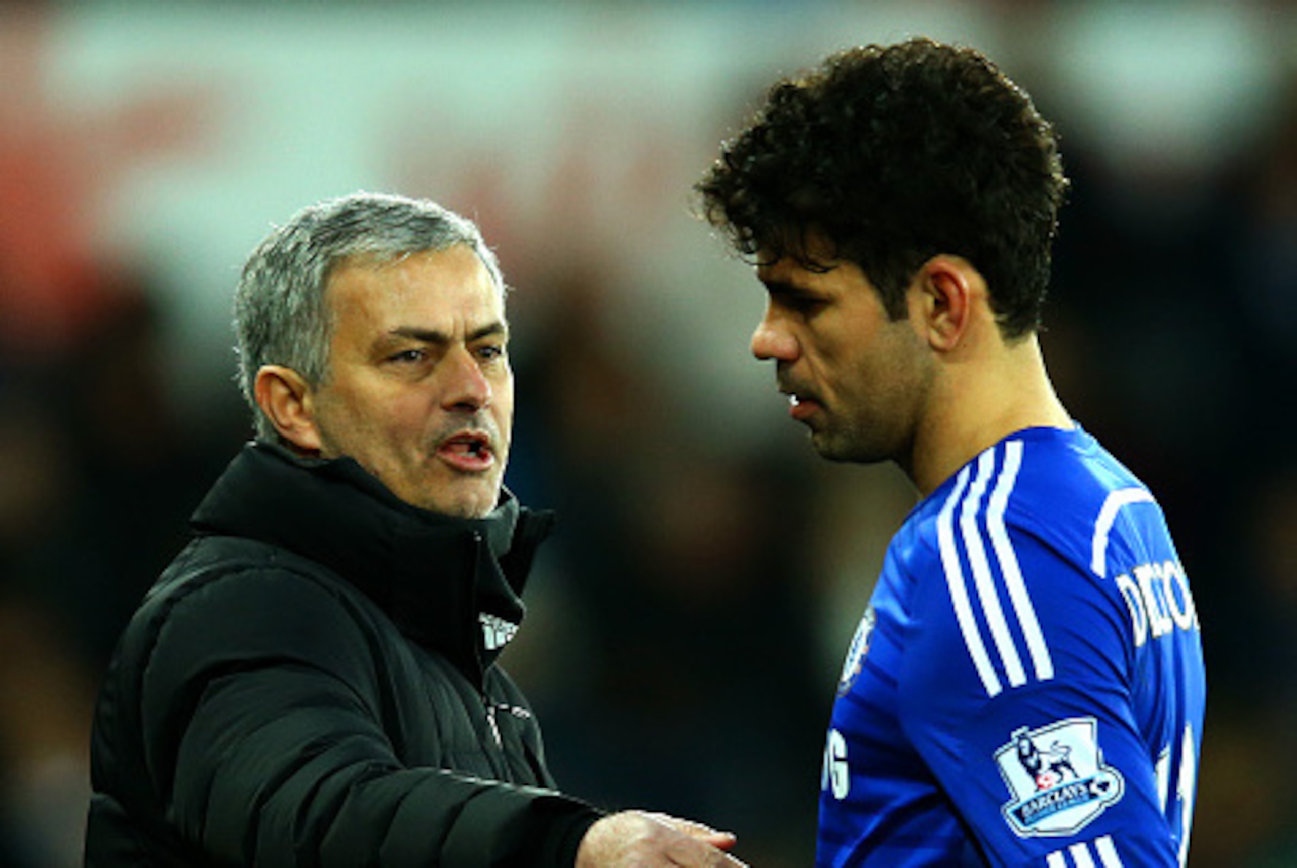 SWANSEA, WALES - JANUARY 17:  Jose Mourinho, manager of Chelsea speaks with Diego Costa as he is substituted during the Barclays Premier League match between Swansea City and Chelsea at Liberty Stadium on January 17, 2015 in Swansea, Wales.  (Photo by Ric