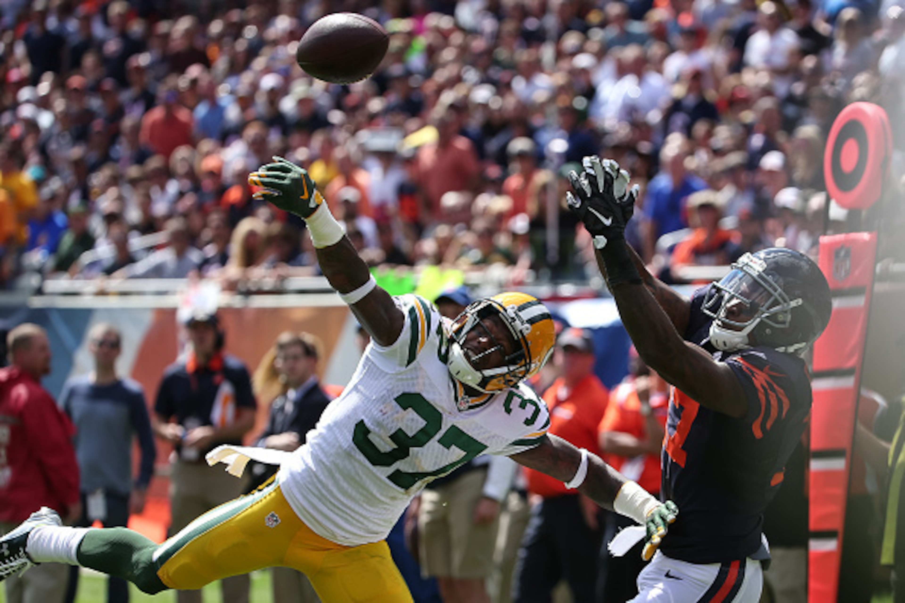 CHICAGO, IL - SEPTEMBER 13:  Sam Shields #37 of the Green Bay Packers tips the football away from  Alshon Jeffery #17 of the Chicago Bears in the first half at Soldier Field on September 13, 2015 in Chicago, Illinois.  (Photo by Jonathan Daniel/Getty Imag