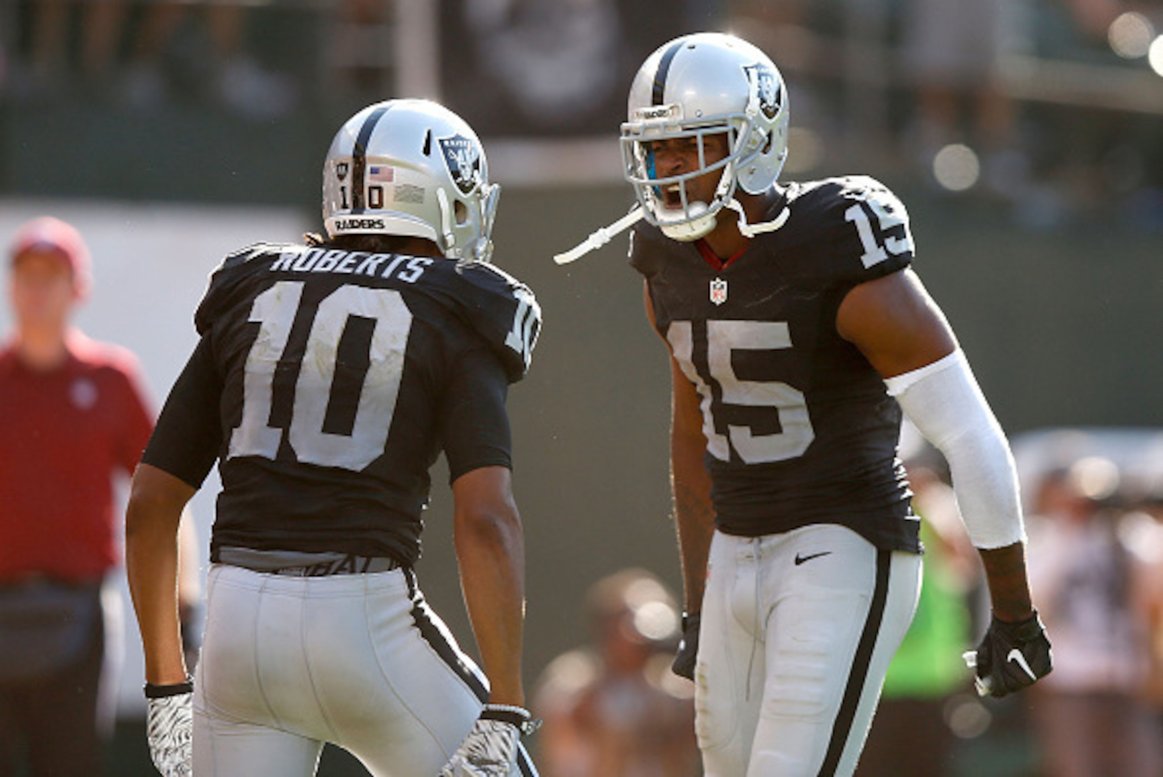OAKLAND, CA - SEPTEMBER 20:  Seth Roberts #10 of the Oakland Raiders celebrates the game winning touchdown with Michael Crabtree #15 of the Oakland Raiders in the fourth quarter against the Baltimore Ravens at Oakland-Alameda County Coliseum on September 
