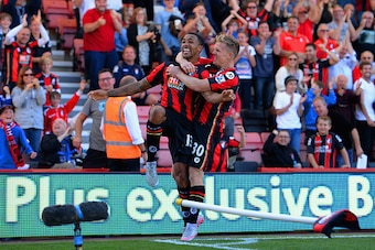BOURNEMOUTH, ENGLAND - SEPTEMBER 19:  Callum Wilson (L) of Bournemouth celebrates scoring his team's first goal with his team mate Matt Ritchie (R) during the Barclays Premier League match between A.F.C. Bournemouth and Sunderland at Vitality Stadium on S