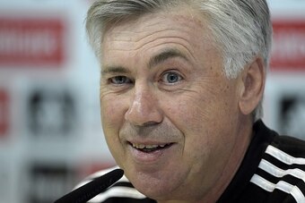 Real Madrid's Italian coach Carlo Ancelotti smiles during a press conference at Valdebebas training center in Madrid on January 23, 2015.   AFP PHOTO / GERARD JULIEN        (Photo credit should read GERARD JULIEN/AFP/Getty Images)