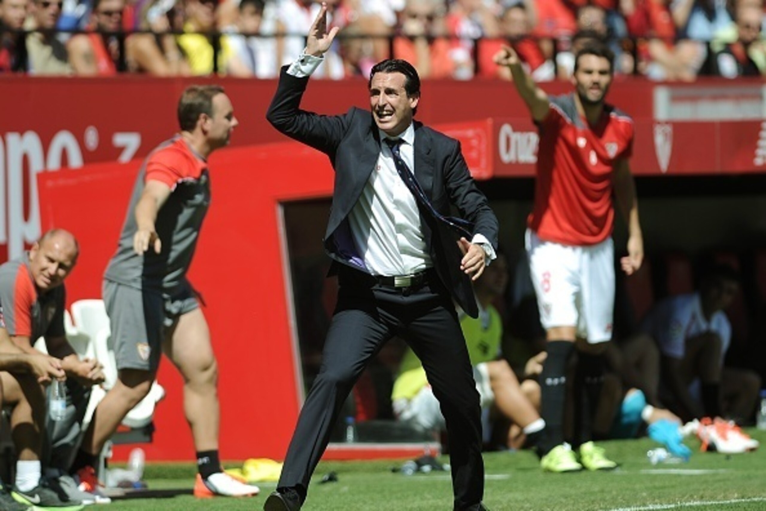 Sevilla's coach Unai Emery gestures from the sidelines during the Spanish league football match Sevilla FC vs Celta de Vigo at the Ramon Sanchez Pizjuan stadium in Sevilla on September 20, 2015.   AFP PHOTO/ CRISTINA QUICLER        (Photo credit should re