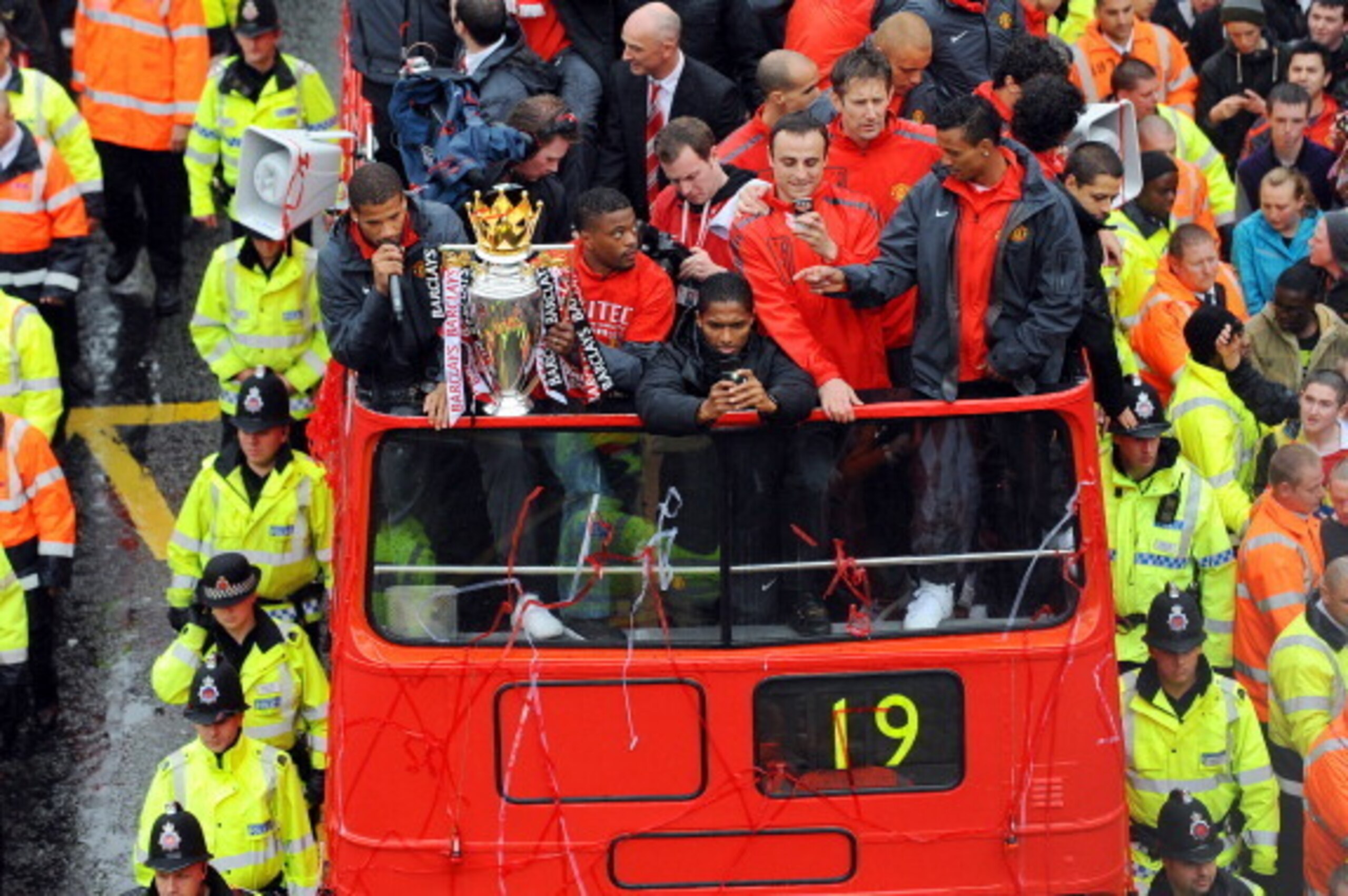 MANCHESTER - MAY 30: (L to R) Bebe, Patrice Evra, Antonio Valencia, Dimitar Berbatov and Nani of Manchester United celebrate with the trophy during the Manchester United Premier League Winners Parade on May 30, 2011 in Manchester, England (Photo by Clint 