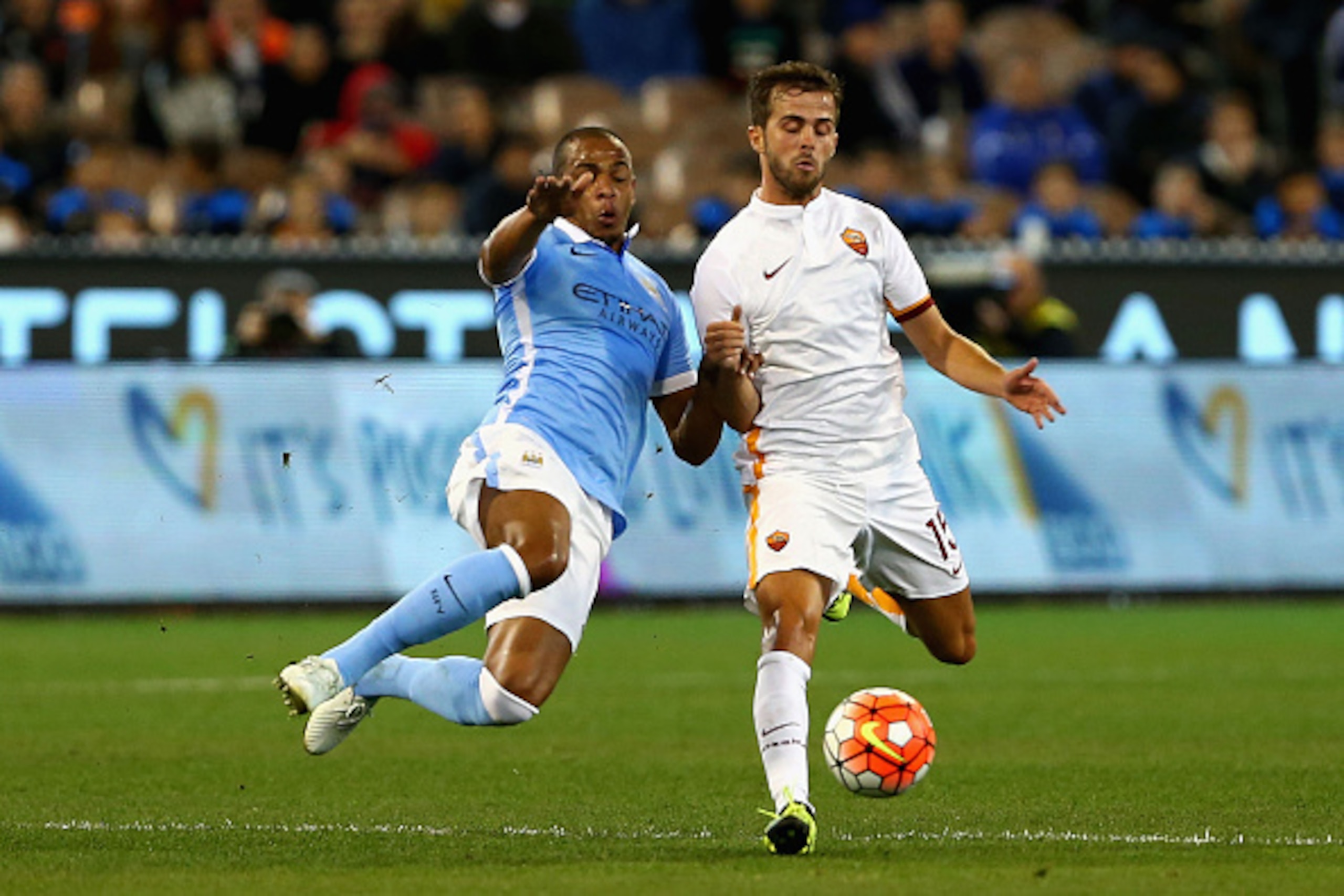 MELBOURNE, AUSTRALIA - JULY 21:  Fernando Reges of Manchester City and Miralem Pjanic of AS Roma contest the ball during the International Champions Cup friendly match between Manchester City and AS Roma at the Melbourne Cricket Ground on July 21, 2015 in