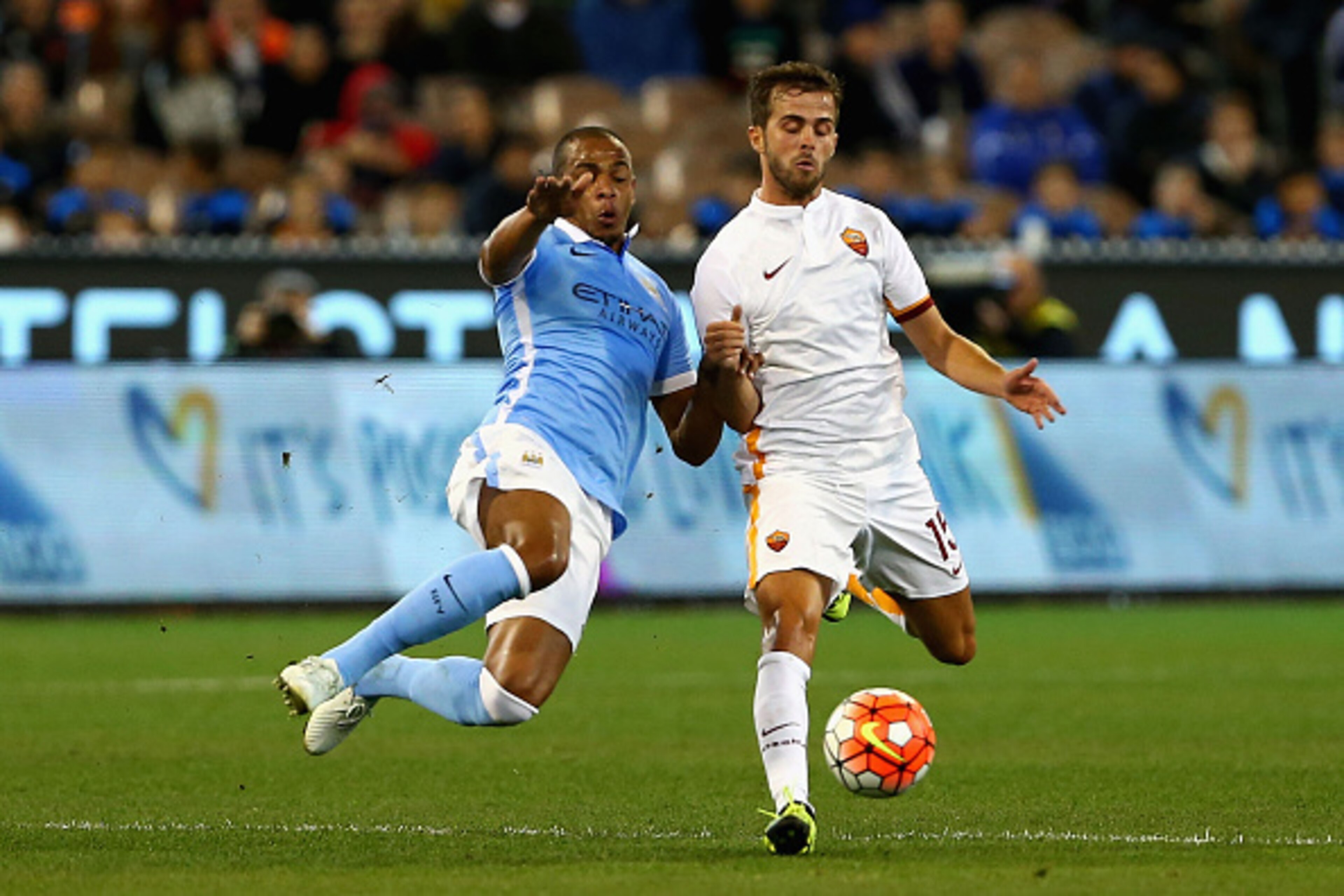 MELBOURNE, AUSTRALIA - JULY 21:  Fernando Reges of Manchester City and Miralem Pjanic of AS Roma contest the ball during the International Champions Cup friendly match between Manchester City and AS Roma at the Melbourne Cricket Ground on July 21, 2015 in