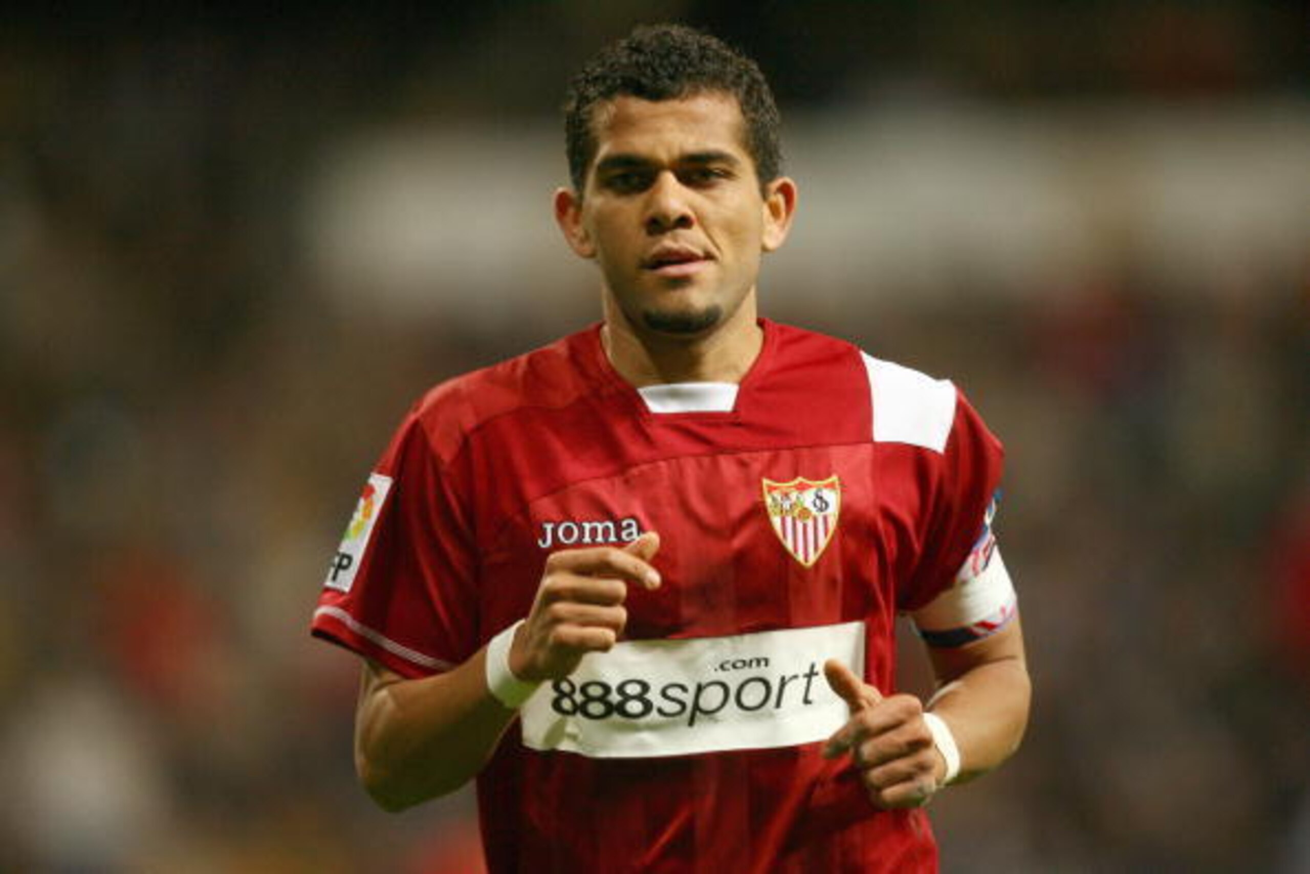Sevilla's Dani Alves gestures during a Spanish league football match against Real Madrid at the Santiago Bernabeu Stadium, on March 30, 2008 in Madrid. Real Madrid won 3-1. AFP PHOTO/Pedro ARMESTRE  (Photo credit should read PEDRO ARMESTRE/AFP/Getty Image