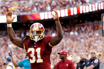 LANDOVER, MD - SEPTEMBER 20: Running back Matt Jones #31 of the Washington Redskins celebrates after scoring a fourth quarter touchdown during a game against the St. Louis Rams at FedExField on September 20, 2015 in Landover, Maryland. (Photo by Matt Hazl