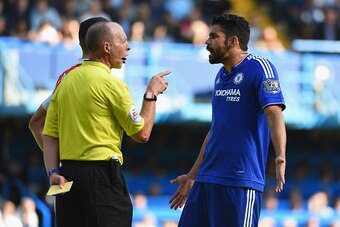 LONDON, ENGLAND - SEPTEMBER 19:  Diego Costa of Chelsea is shown a yellow card by referee Mike Dean during the Barclays Premier League match between Chelsea and Arsenal at Stamford Bridge on September 19, 2015 in London, United Kingdom.  (Photo by Ross Ki