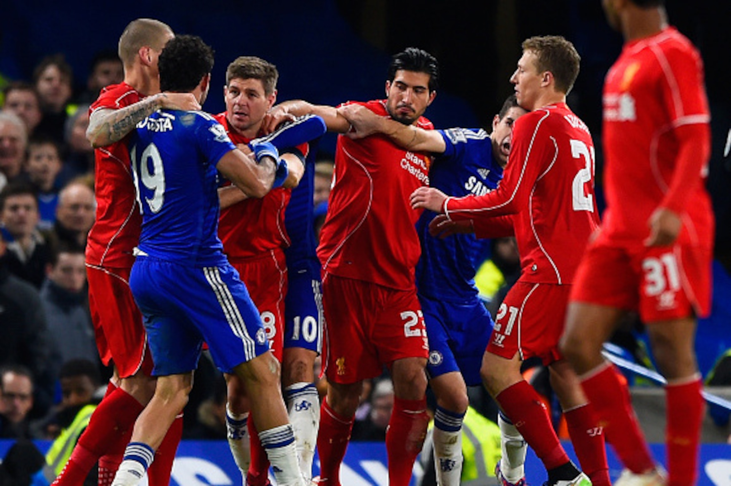 LONDON, ENGLAND - JANUARY 27:  Diego Costa of Chelsea clashes with Steven Gerrard and Emre Can of Liverpool during the Capital One Cup Semi-Final second leg between Chelsea and Liverpool at Stamford Bridge on January 27, 2015 in London, England.  (Photo b