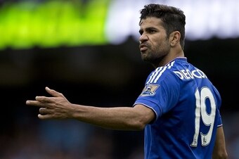 Chelsea's Brazilian-born Spanish striker Diego Costa gestures towards the referee's assistant during the English Premier League football match between Manchester City and Chelsea at The Etihad stadium in Manchester, north west England on August 16, 2015. 